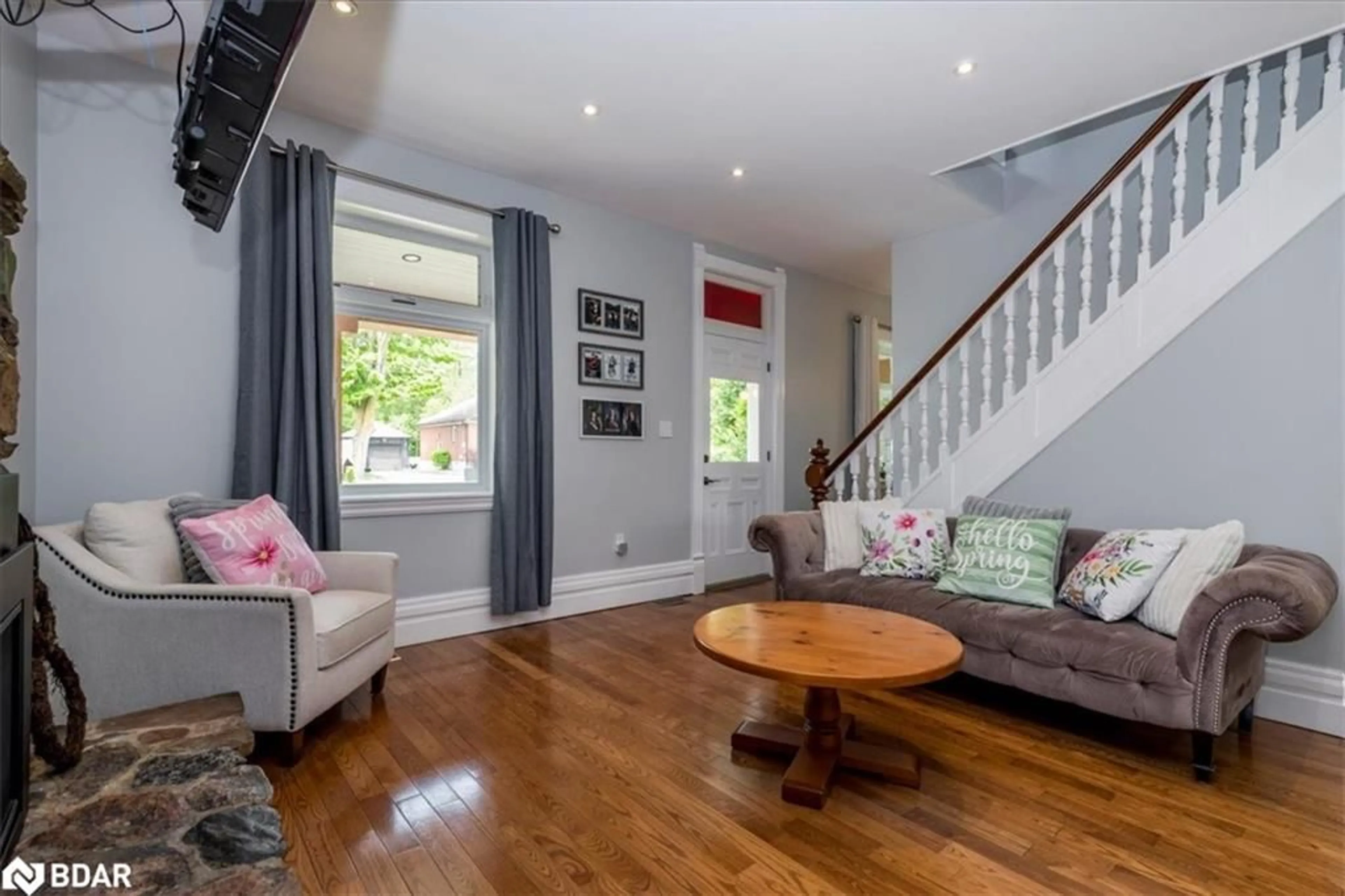 Living room with furniture, wood/laminate floor for 8061 Main St, Everett Ontario L0M 1J0