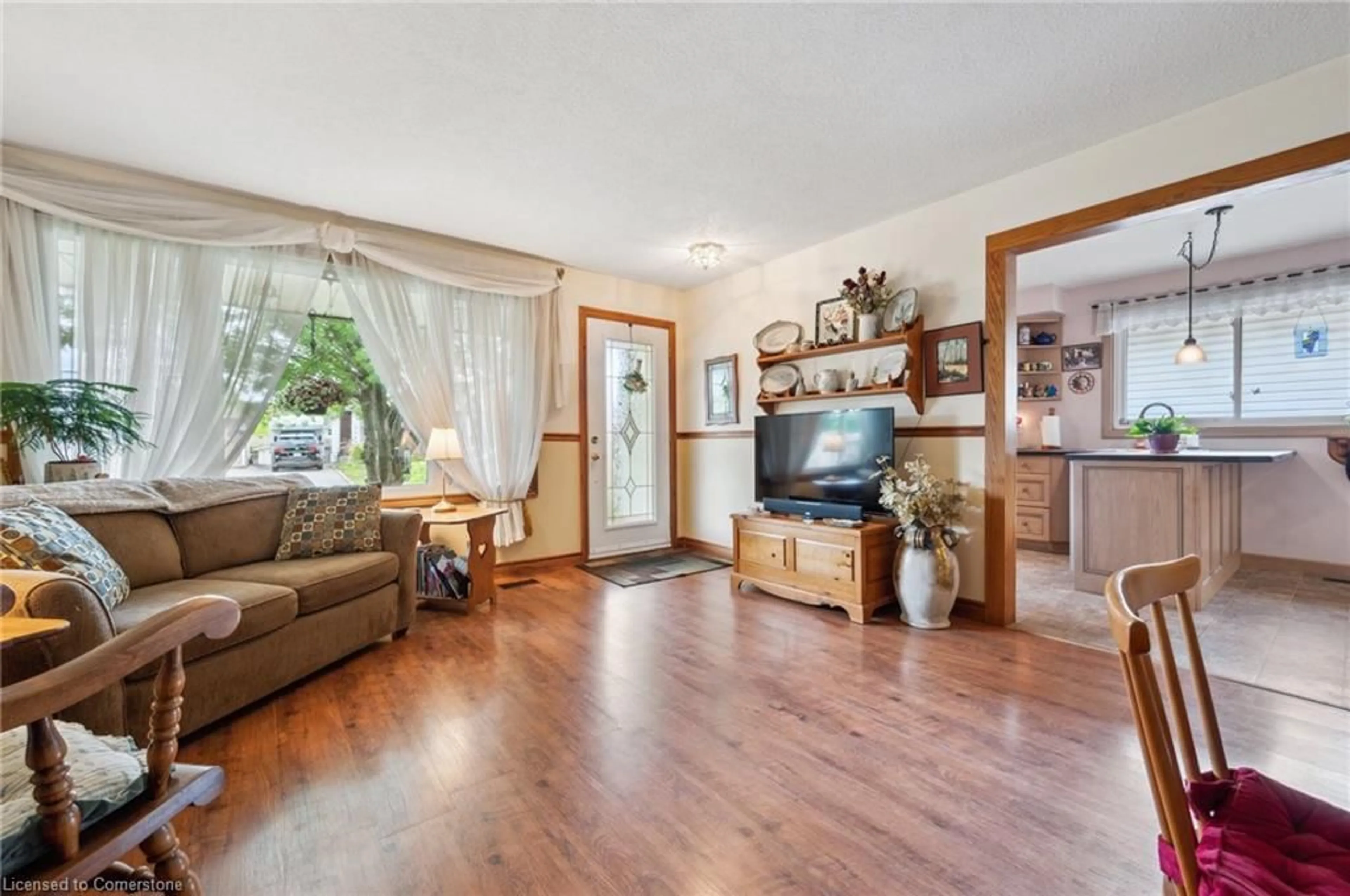 Living room with furniture, wood/laminate floor for 56 Blackhorne Cres, Kitchener Ontario N2E 1T1