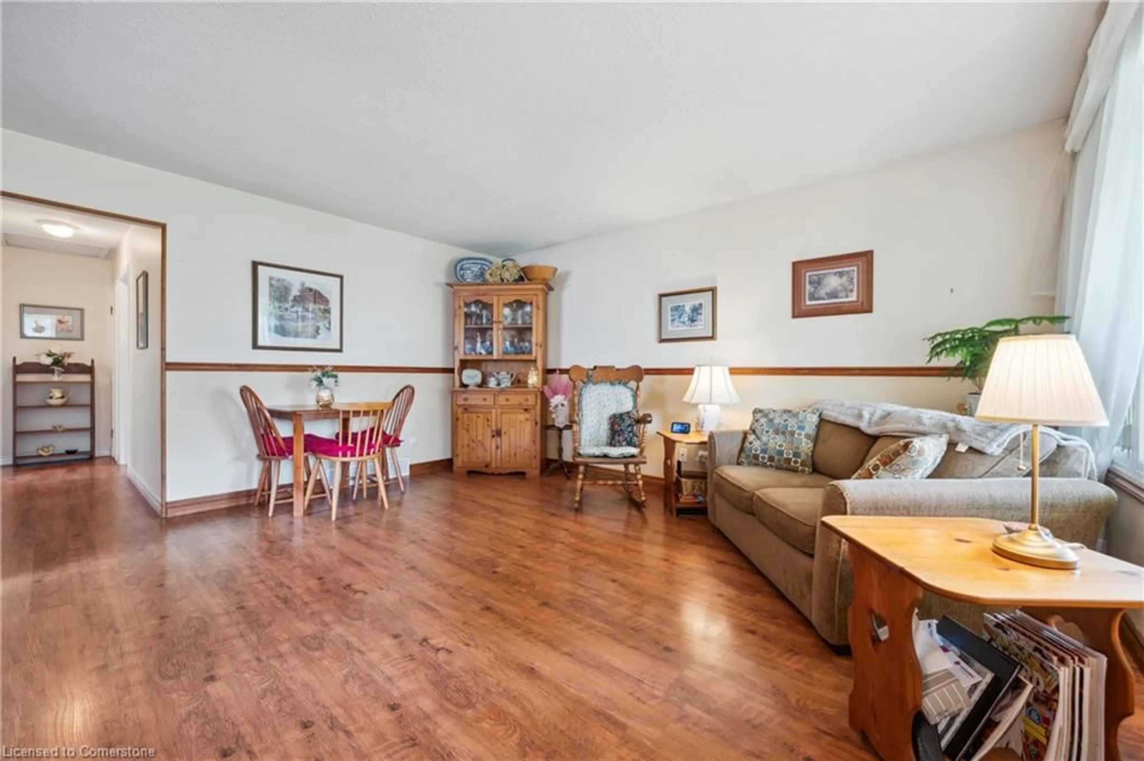 Living room with furniture, wood/laminate floor for 56 Blackhorne Cres, Kitchener Ontario N2E 1T1