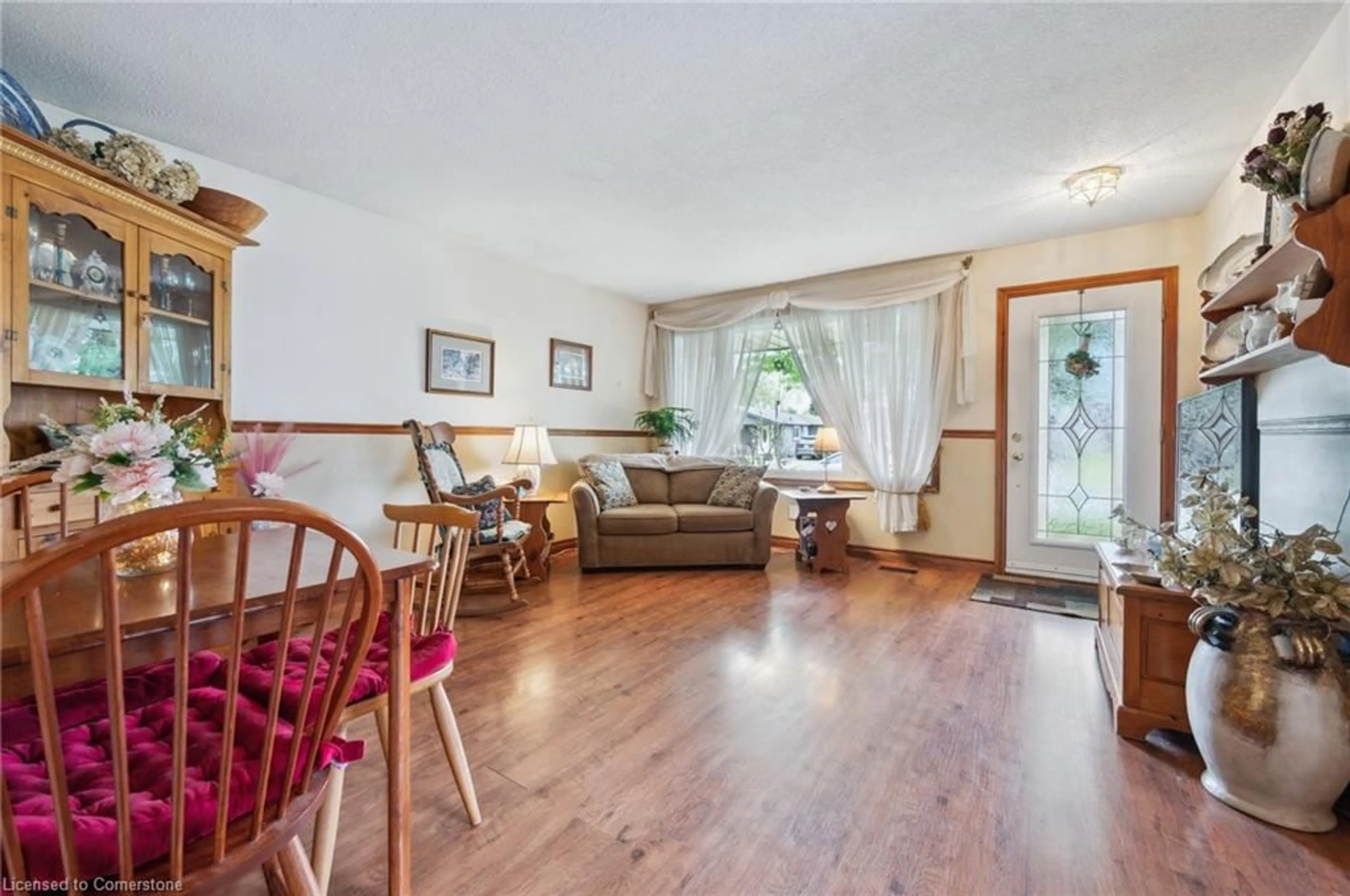 Living room with furniture, wood/laminate floor for 56 Blackhorne Cres, Kitchener Ontario N2E 1T1