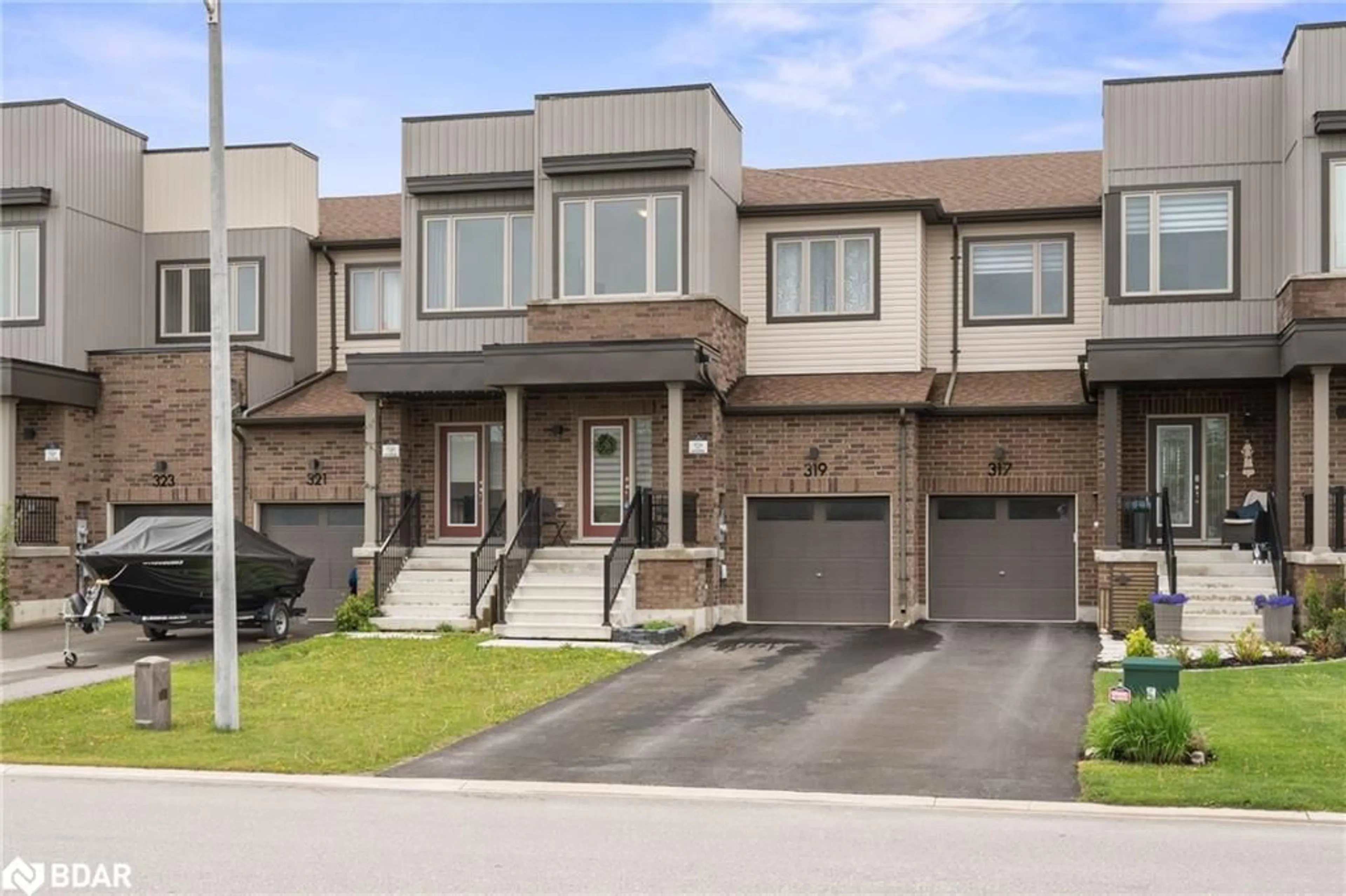 Home with brick exterior material, street for 319 Atkinson St, Stayner Ontario L0M 1S0