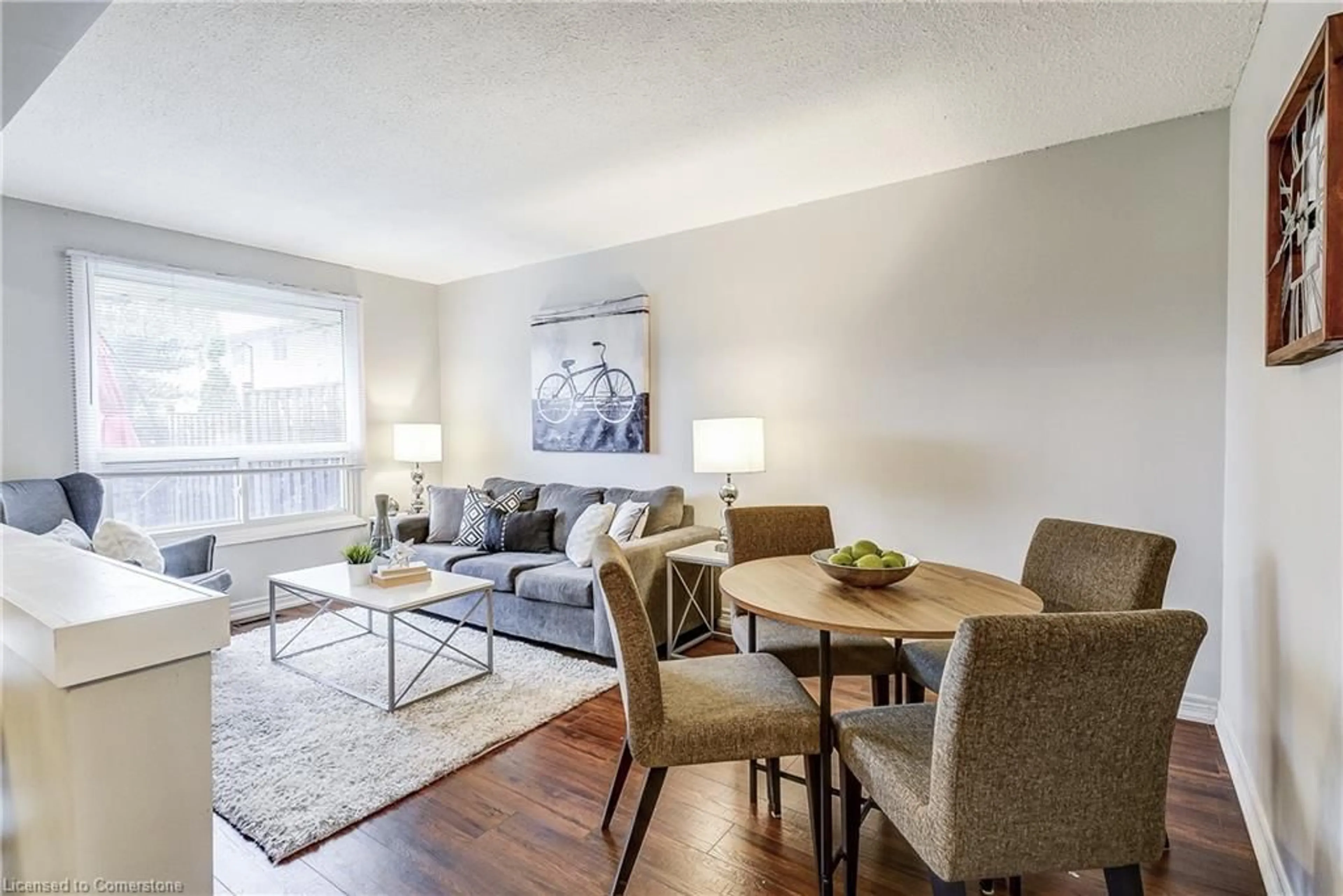 Living room with furniture, wood/laminate floor for 1350 Limeridge Rd #26, Hamilton Ontario L8W 1L6
