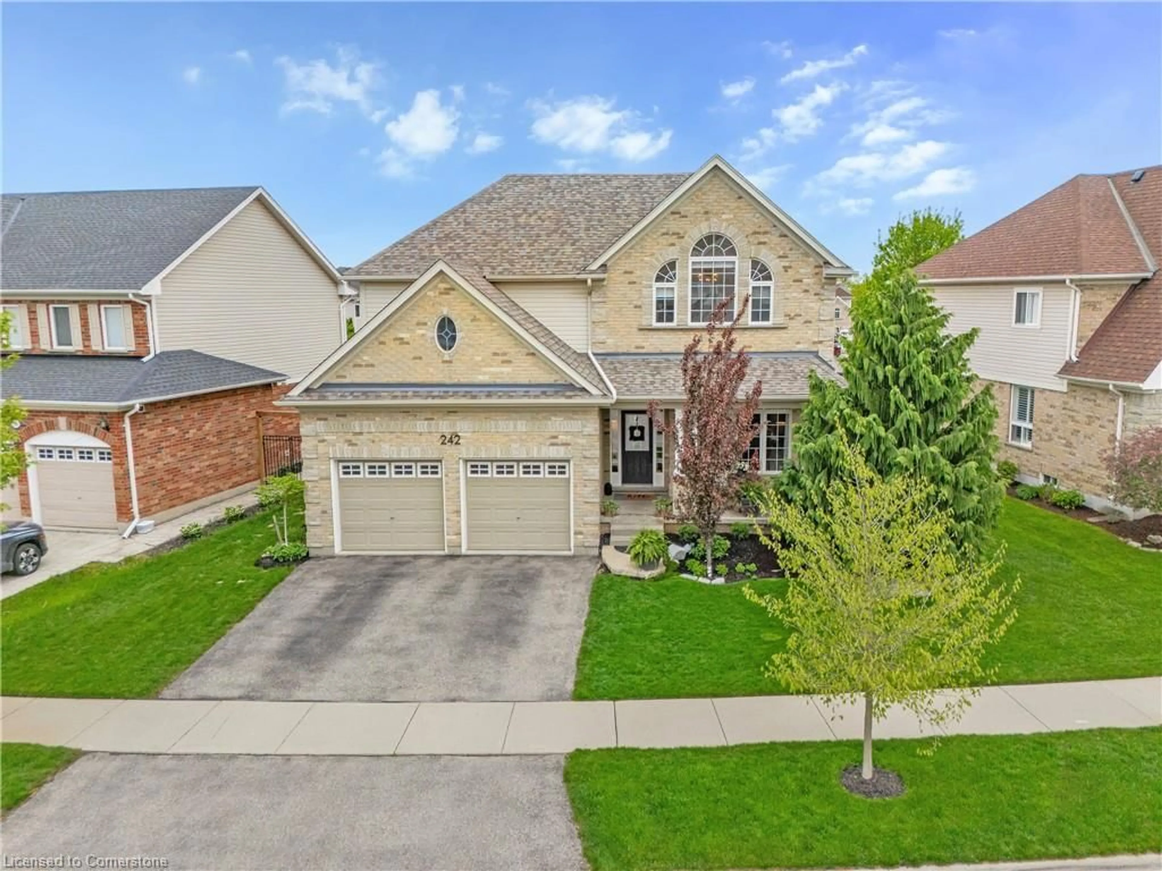 Home with brick exterior material, street for 242 Waterbend Cres, Kitchener Ontario N2A 4L3