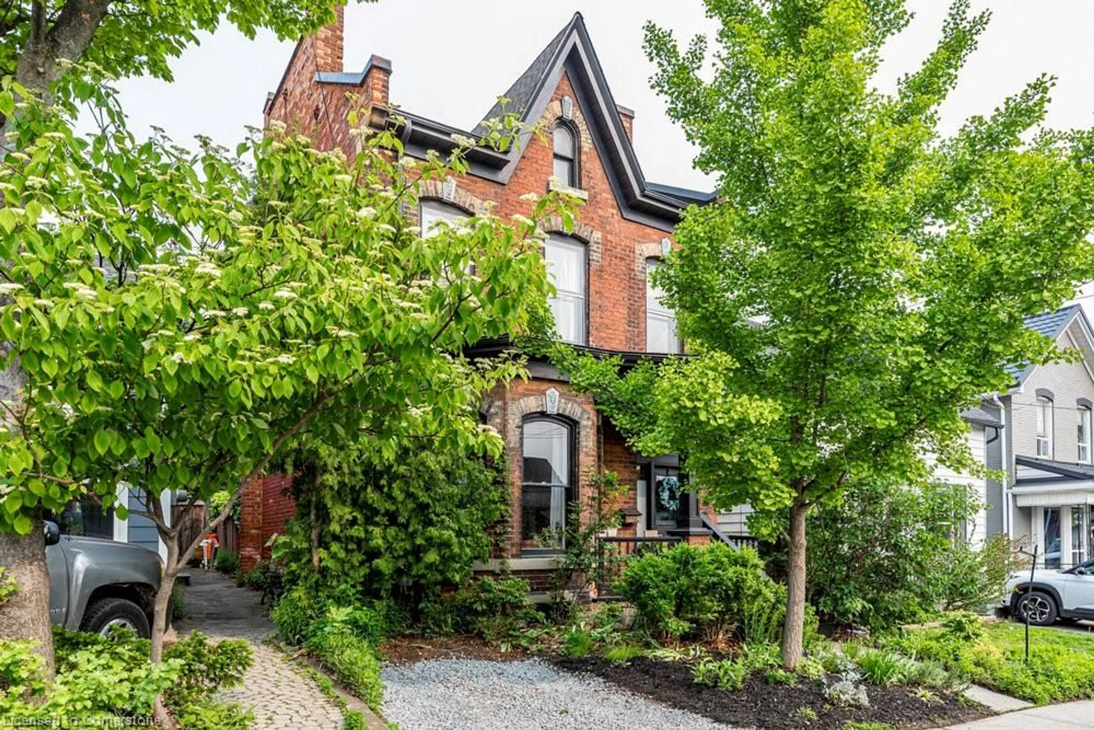 Home with brick exterior material, street for 115 Locke St, Hamilton Ontario L8R 3A7