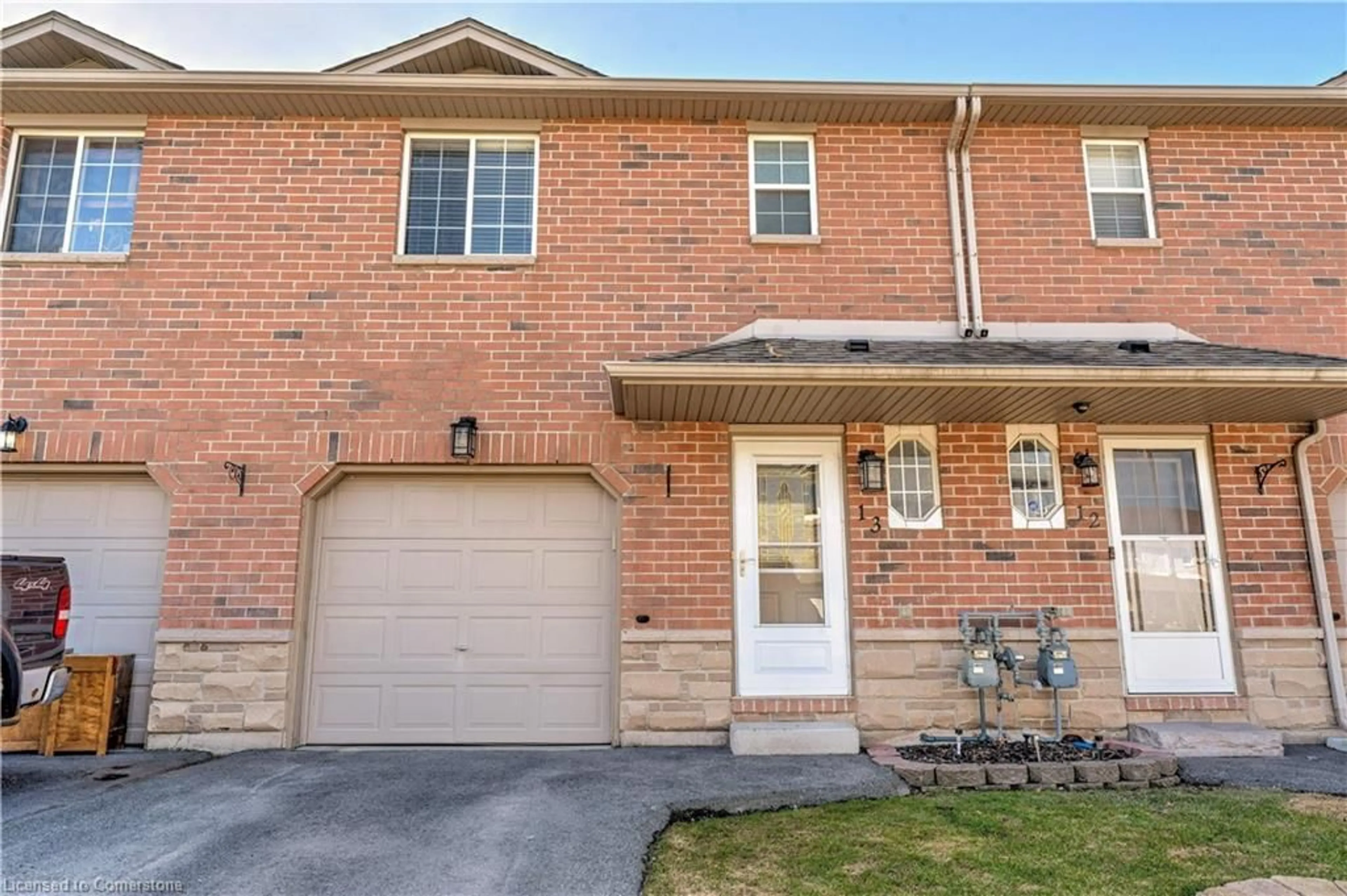 Home with brick exterior material, street for 39 Pinewoods Dr #13, Stoney Creek Ontario L8J 3Z3