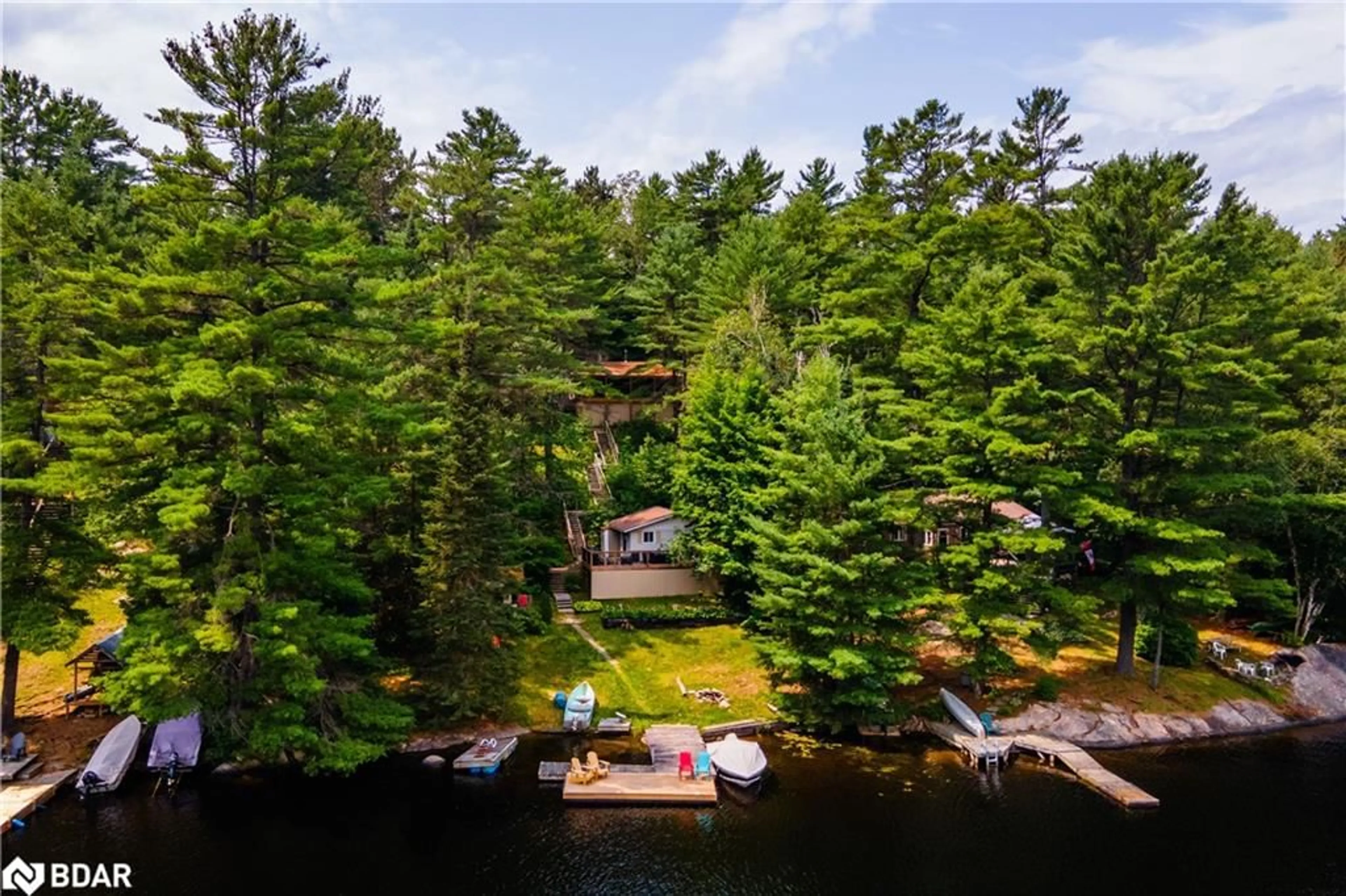 A pic from outside/outdoor area/front of a property/back of a property/a pic from drone, water/lake/river/ocean view for 1370 Ranger Bay Rd, Loring Ontario P0H 1S0