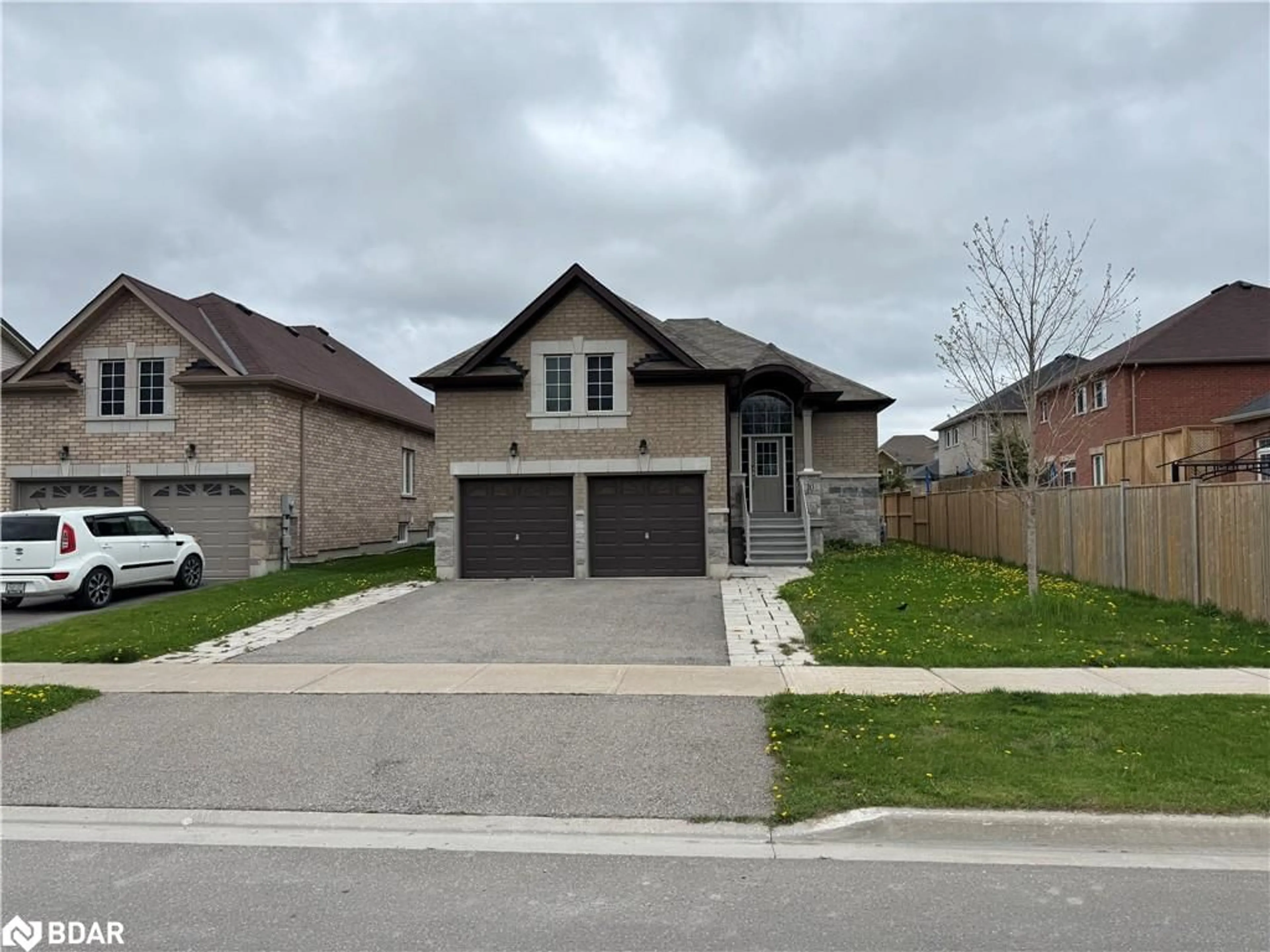 Home with brick exterior material, street for 10 Falvo Street St, Wasaga Beach Ontario L9Z 0G8