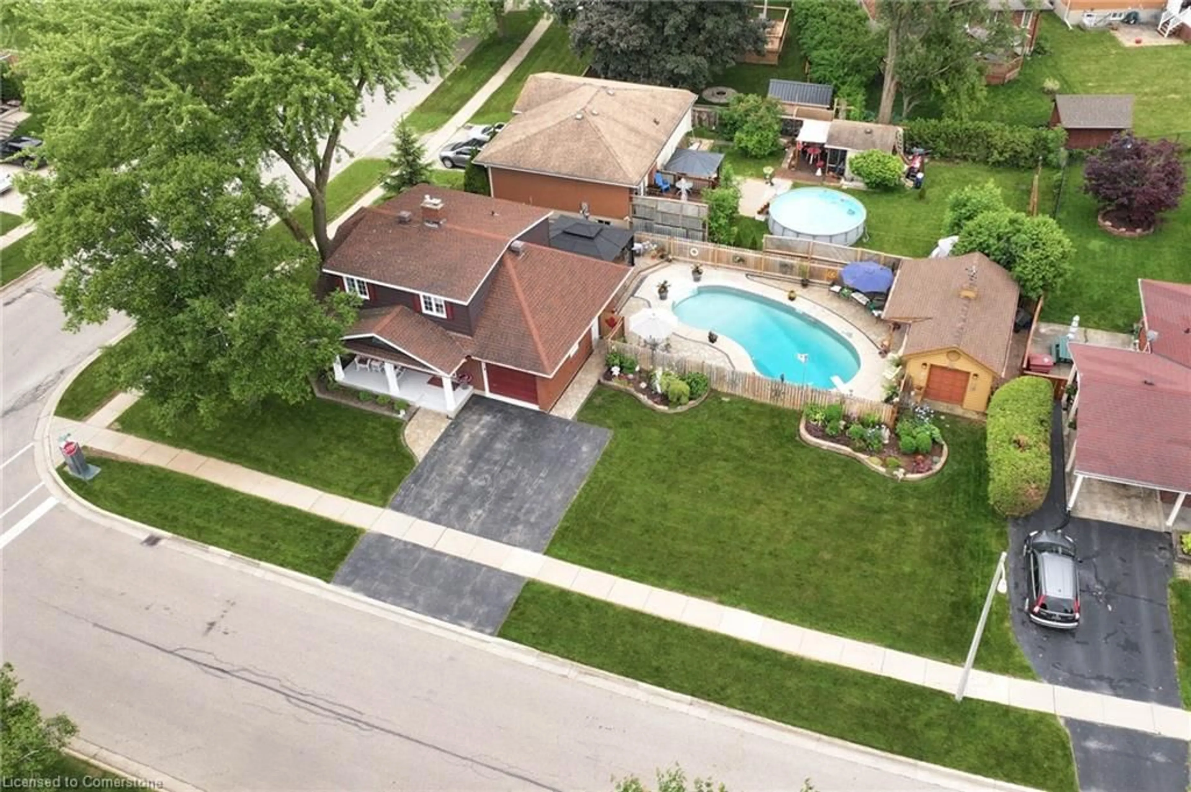 A pic from outside/outdoor area/front of a property/back of a property/a pic from drone, street for 1 Kingfisher Dr, Elmira Ontario N3B 3B4