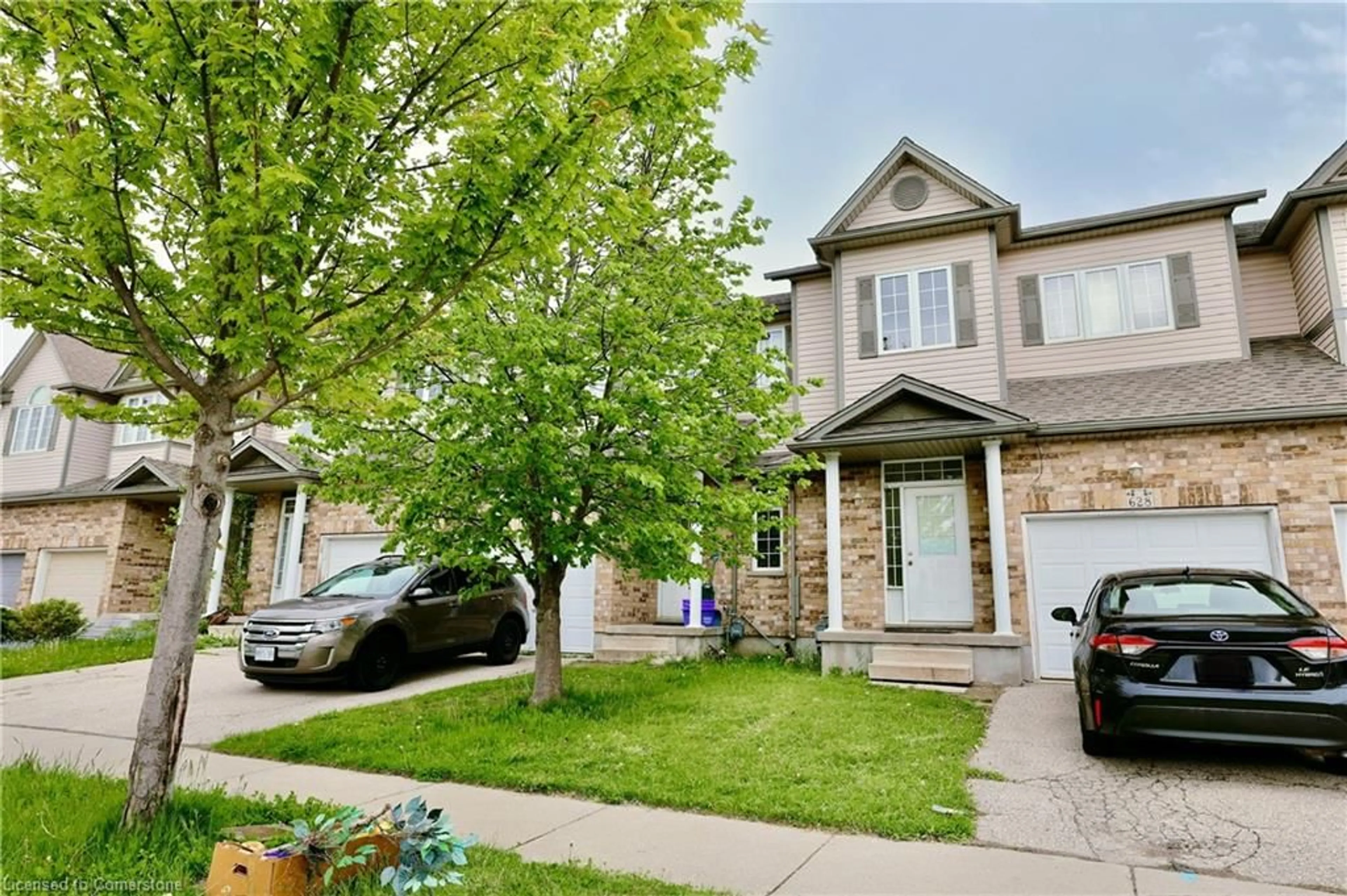 A pic from outside/outdoor area/front of a property/back of a property/a pic from drone, street for 628 Wild Ginger Ave, Waterloo Ontario N2V 2S9