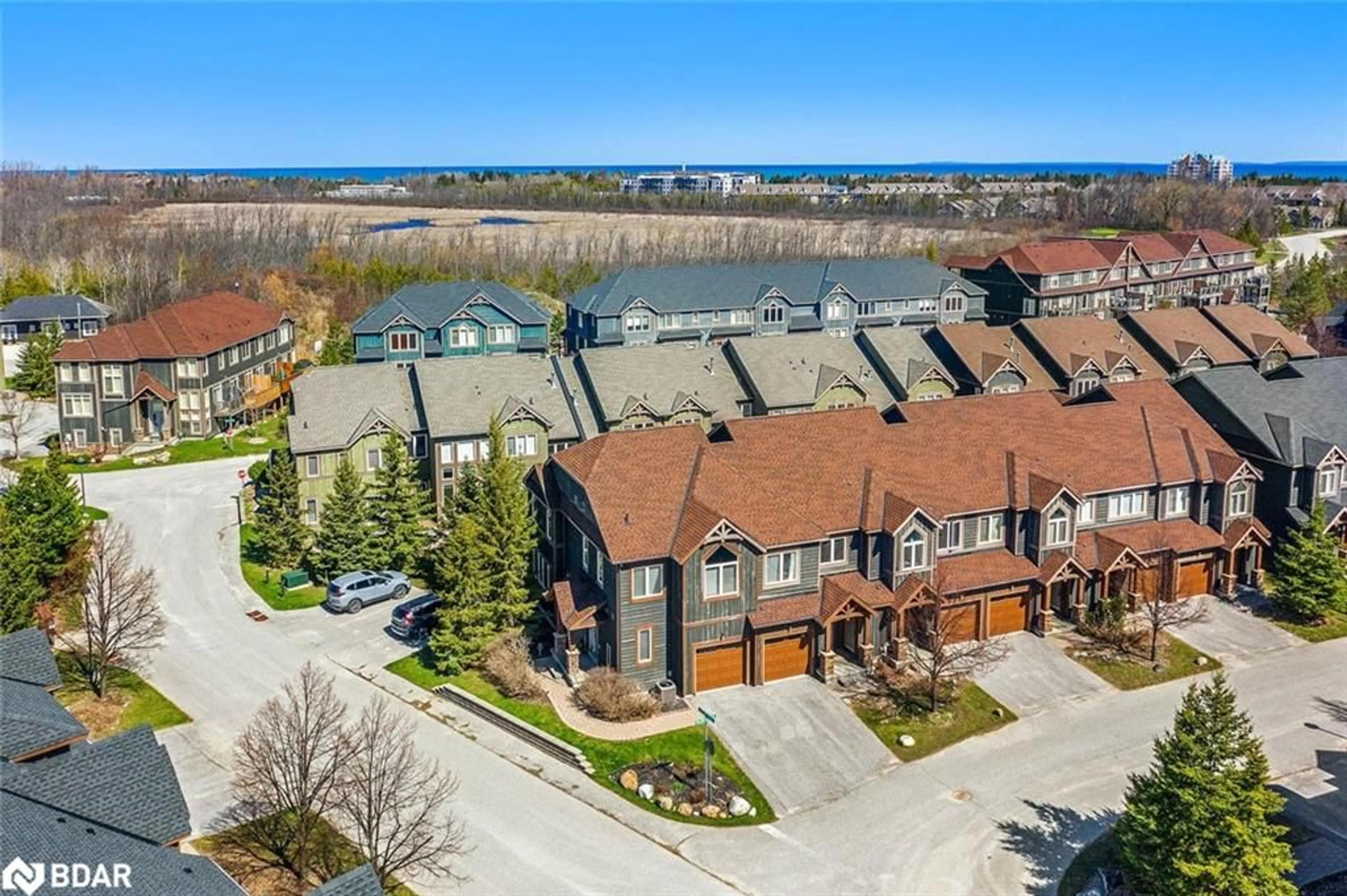 A pic from outside/outdoor area/front of a property/back of a property/a pic from drone, water/lake/river/ocean view for 20 Wildrose Trail #42, Collingwood Ontario L9Y 0J4