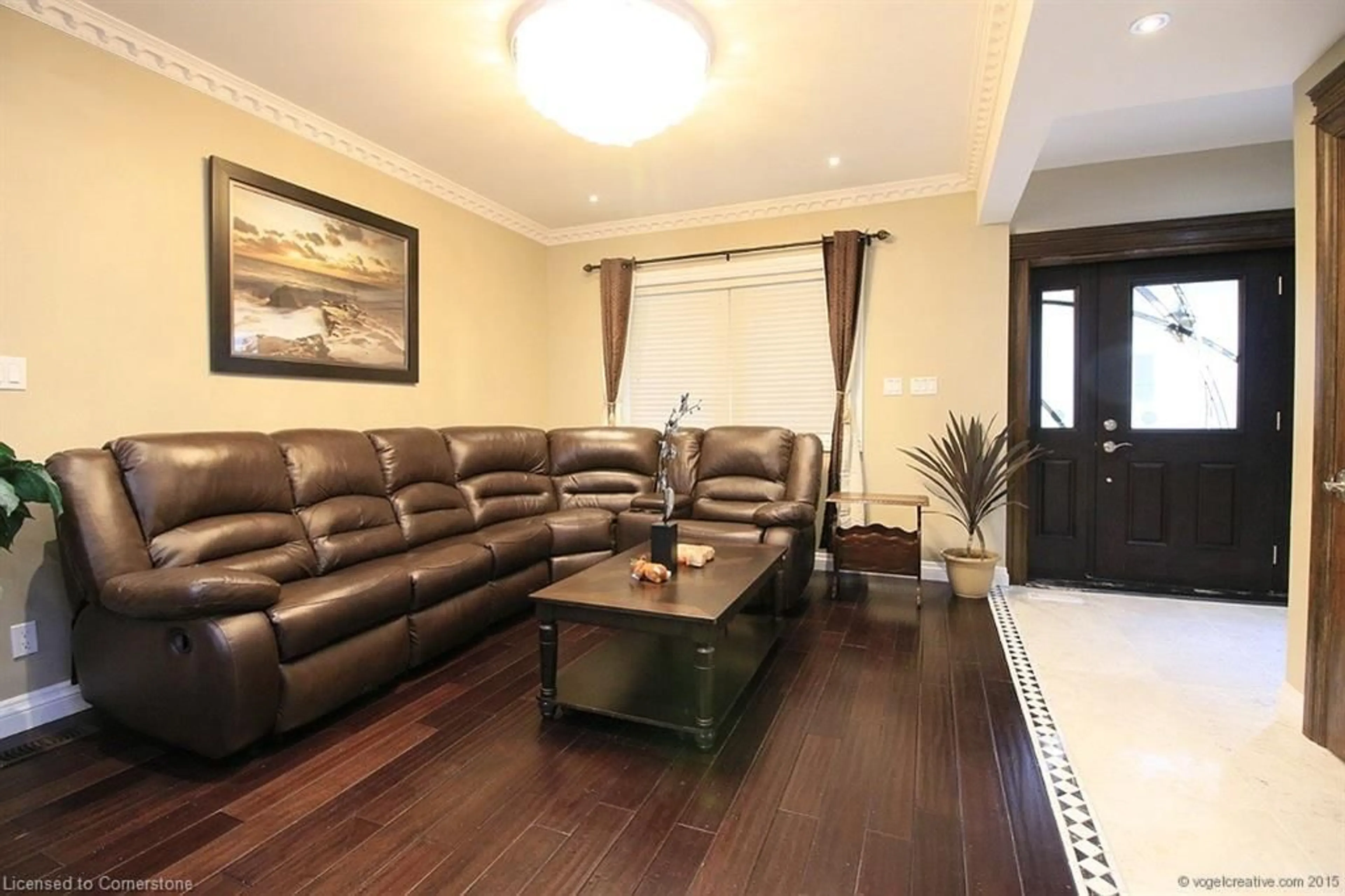Living room with furniture, wood/laminate floor for 71 Paisley Ave, Hamilton Ontario L8S 4H1