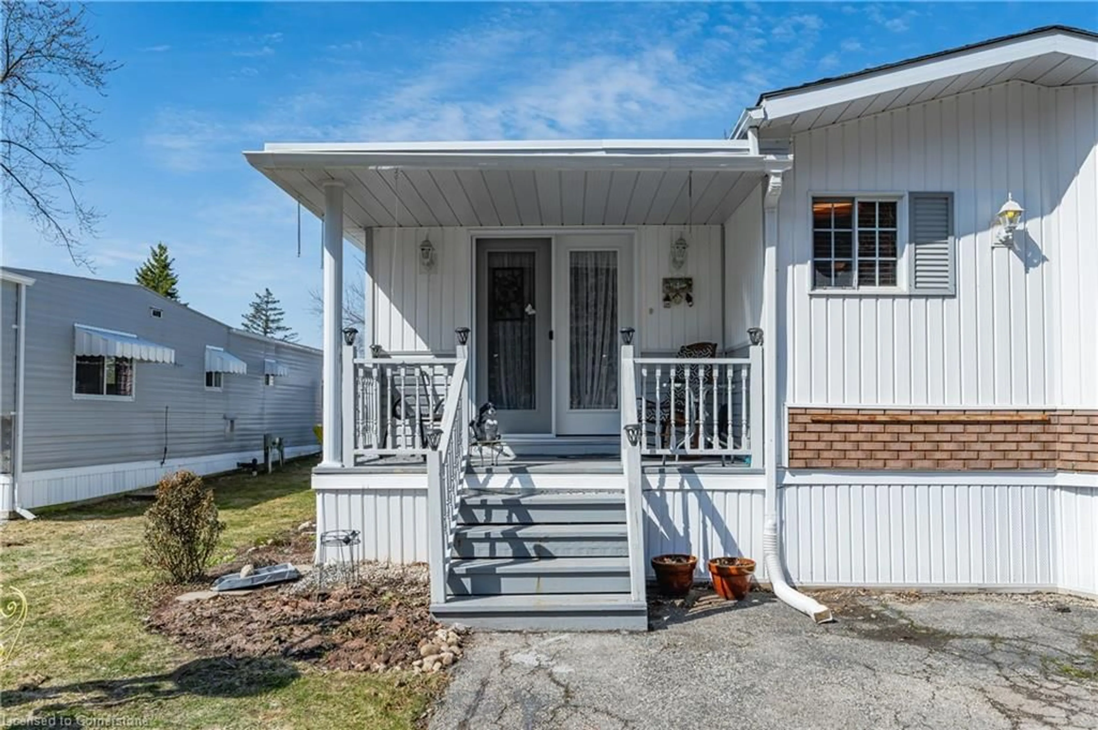 Home with vinyl exterior material, street for 580 Beaver Creek Rd #217, Waterloo Ontario N2J 3Z4