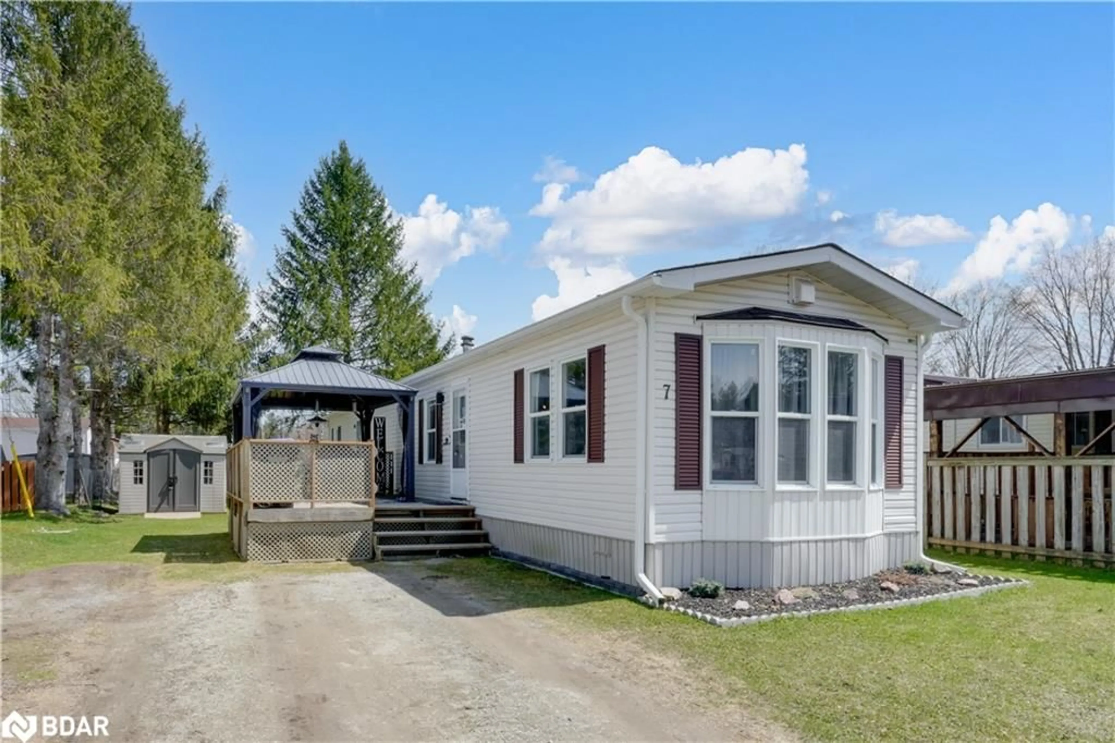 Home with vinyl exterior material, street for 7 Shamrock Cres, Essa Ontario L3W 0A5