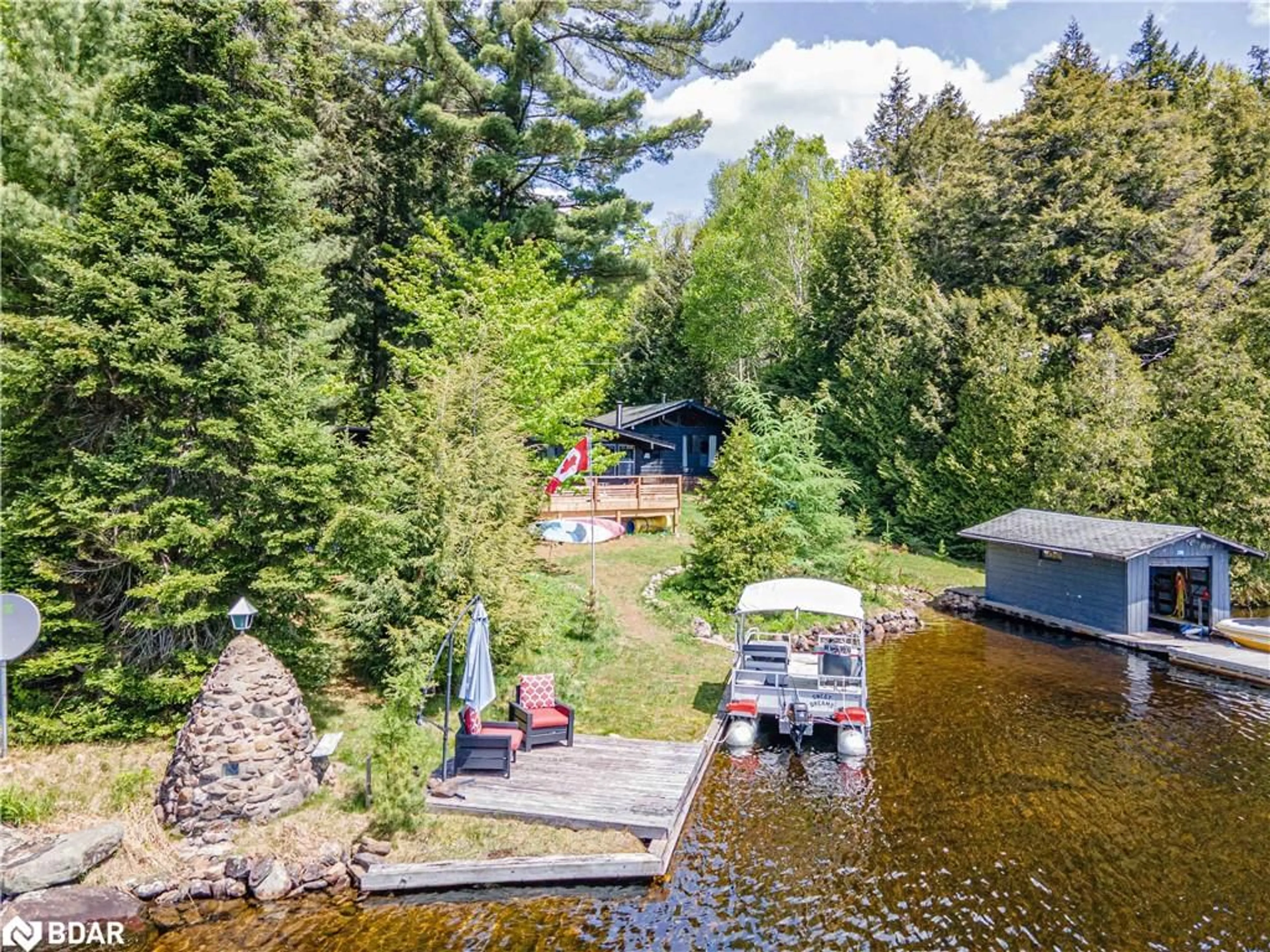 A pic from outside/outdoor area/front of a property/back of a property/a pic from drone, water/lake/river/ocean view for 228 Macbeth Island Island, Bracebridge Ontario P1L 1X1