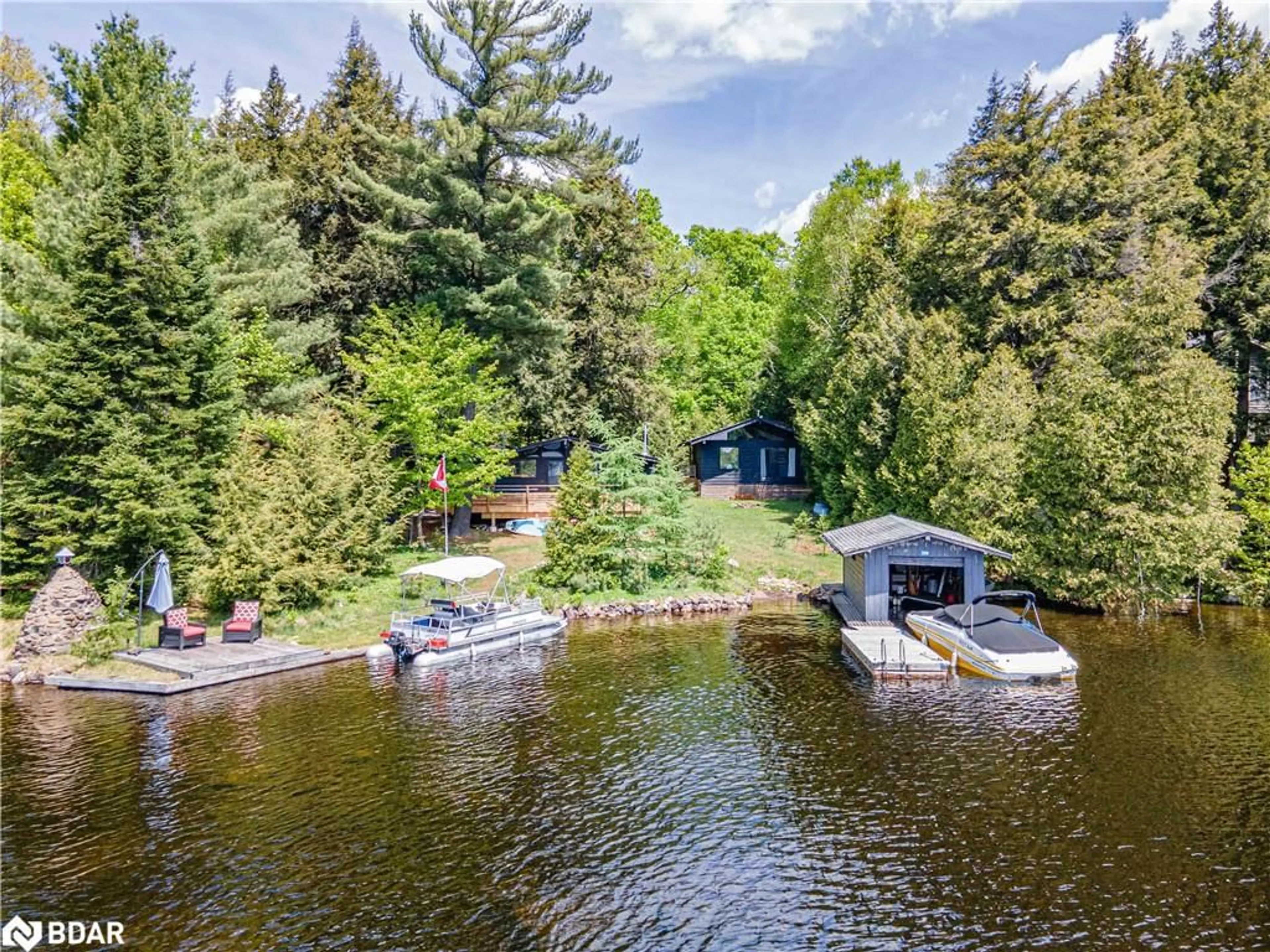 A pic from outside/outdoor area/front of a property/back of a property/a pic from drone, water/lake/river/ocean view for 228 Macbeth Island Island, Bracebridge Ontario P1L 1X1