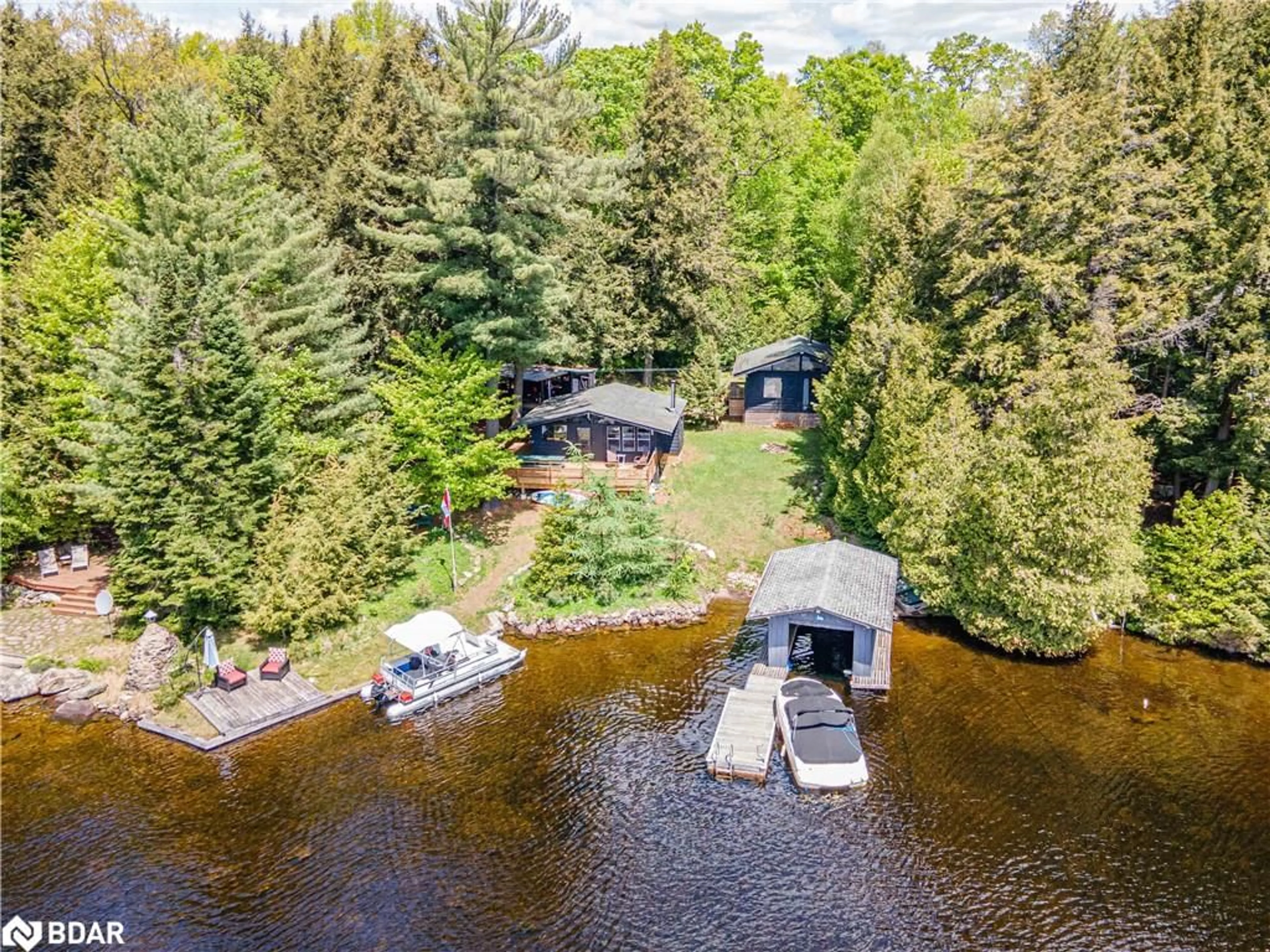 A pic from outside/outdoor area/front of a property/back of a property/a pic from drone, water/lake/river/ocean view for 228 Macbeth Island Island, Bracebridge Ontario P1L 1X1