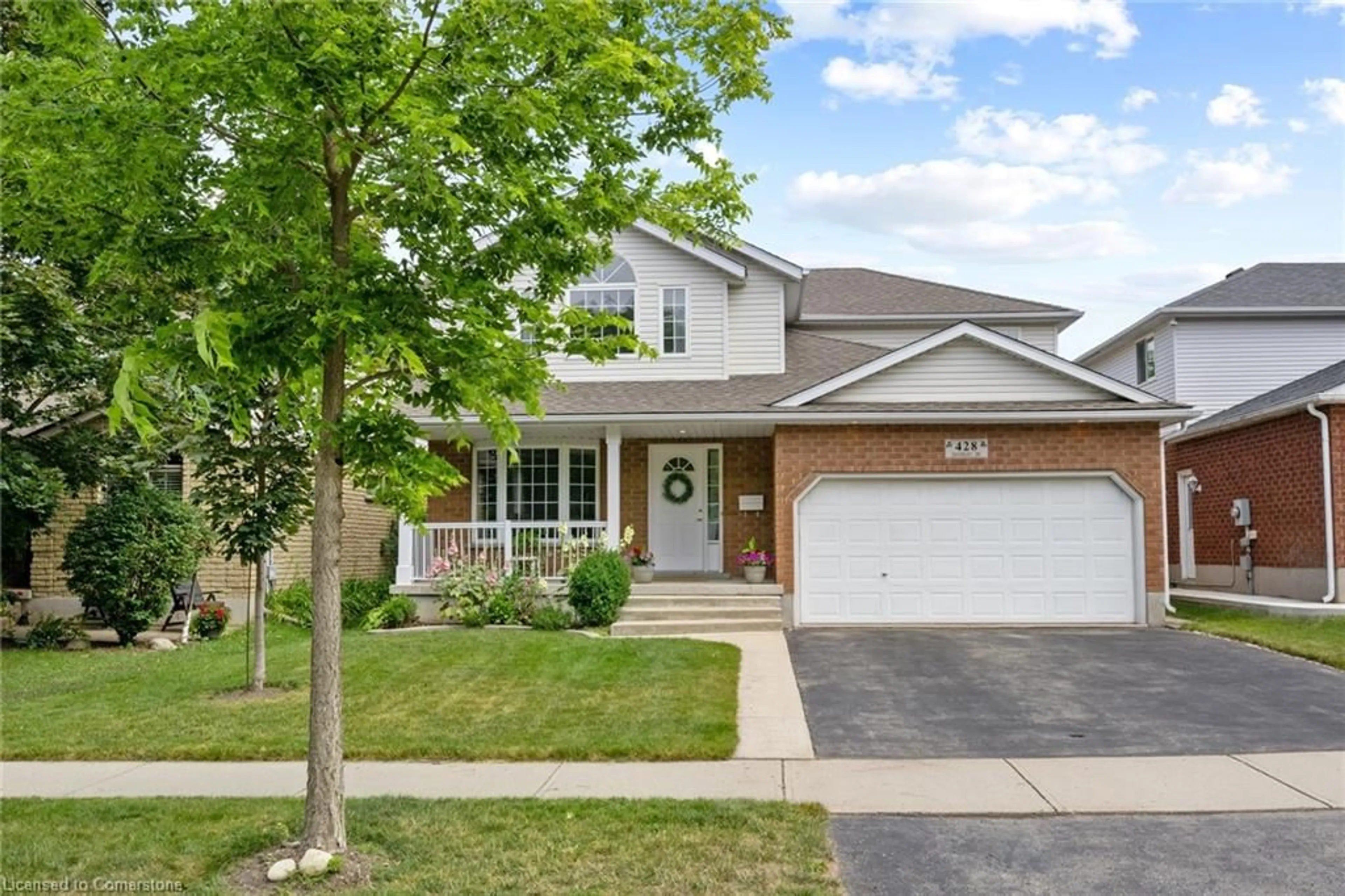 Home with brick exterior material, street for 428 Dansbury Dr, Waterloo Ontario N2K 3X9