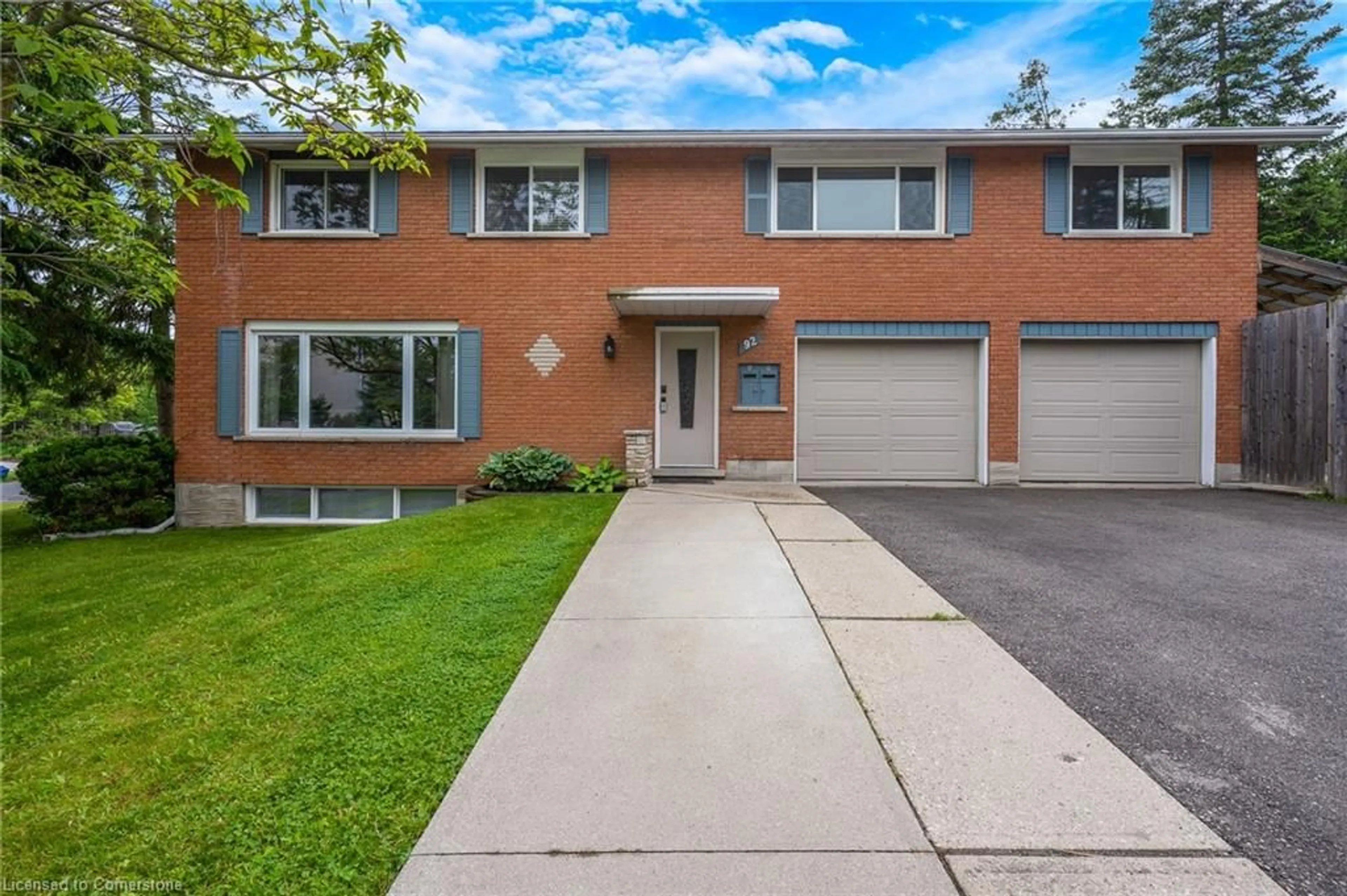 Home with brick exterior material, street for 92 Kenwood Dr, Kitchener Ontario N2B 3H2
