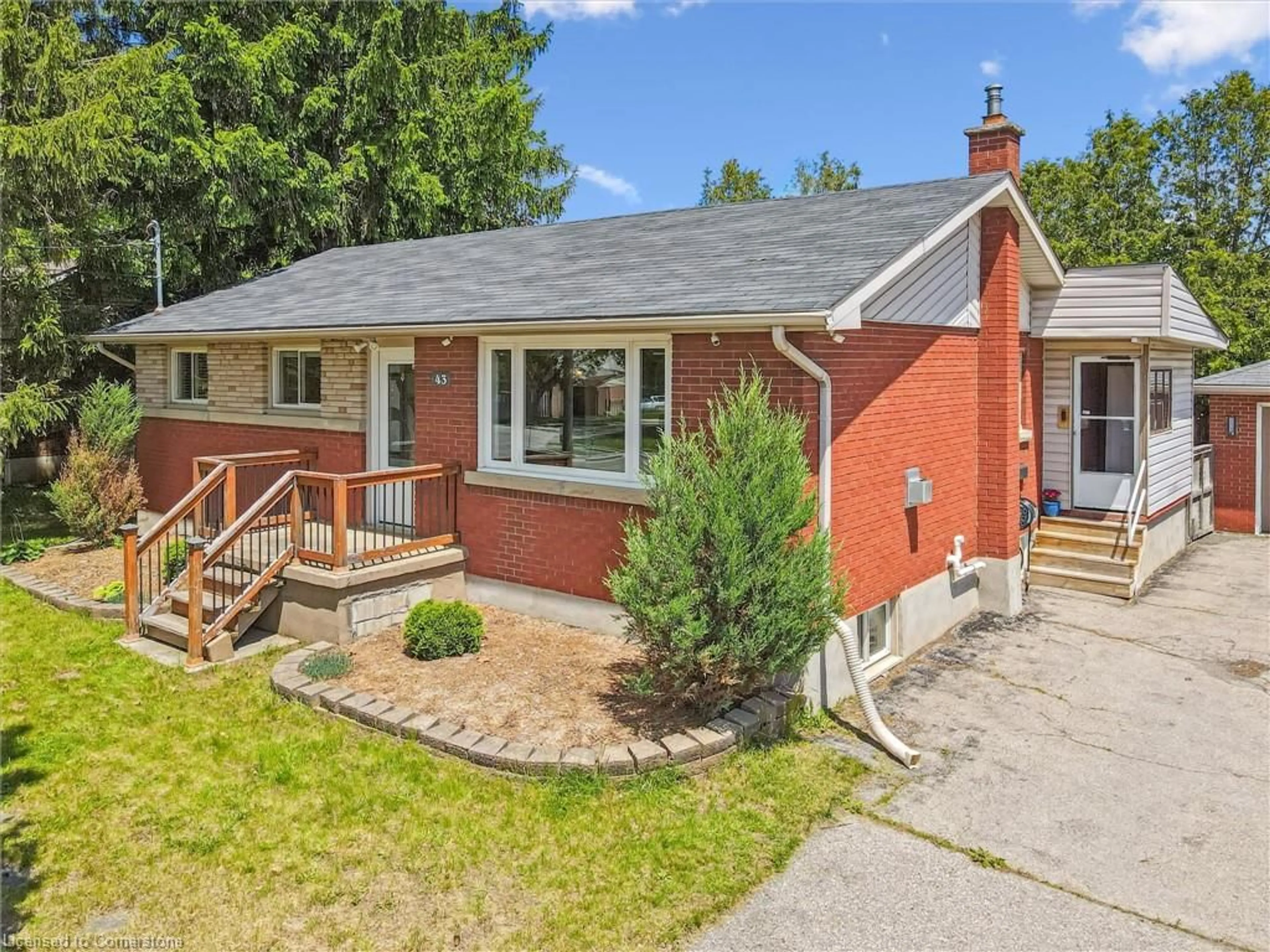 Home with brick exterior material, street for 43 Silvercreek Pky, Guelph Ontario N1H 3T1