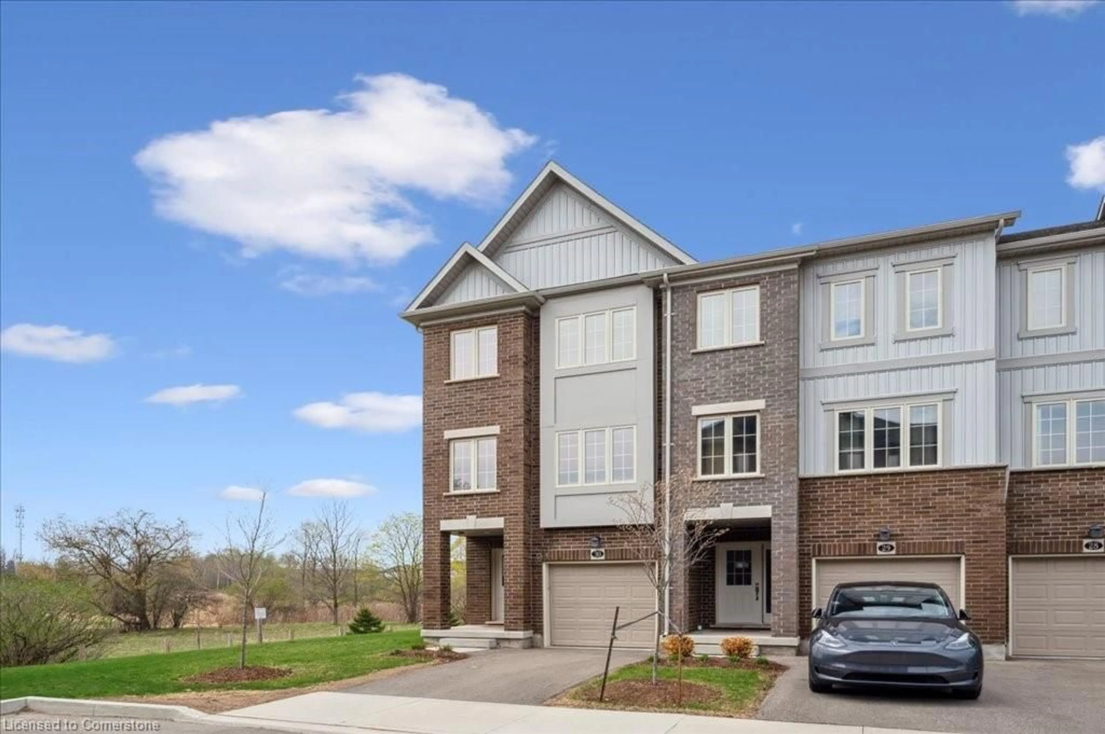 Home with brick exterior material, street for 311 Woolwich St #30, Waterloo Ontario N2K 0H4
