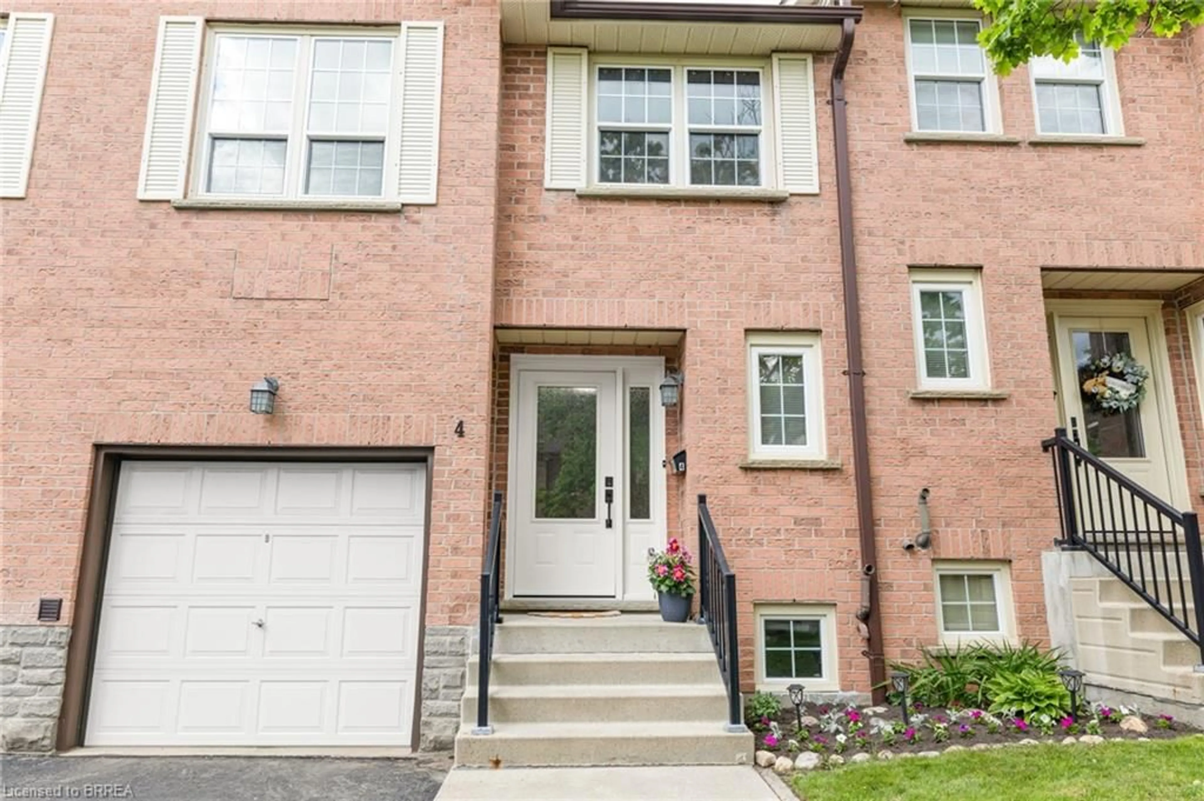 Home with brick exterior material, street for 375 Holiday Inn Dr #4, Cambridge Ontario N3C 3P6