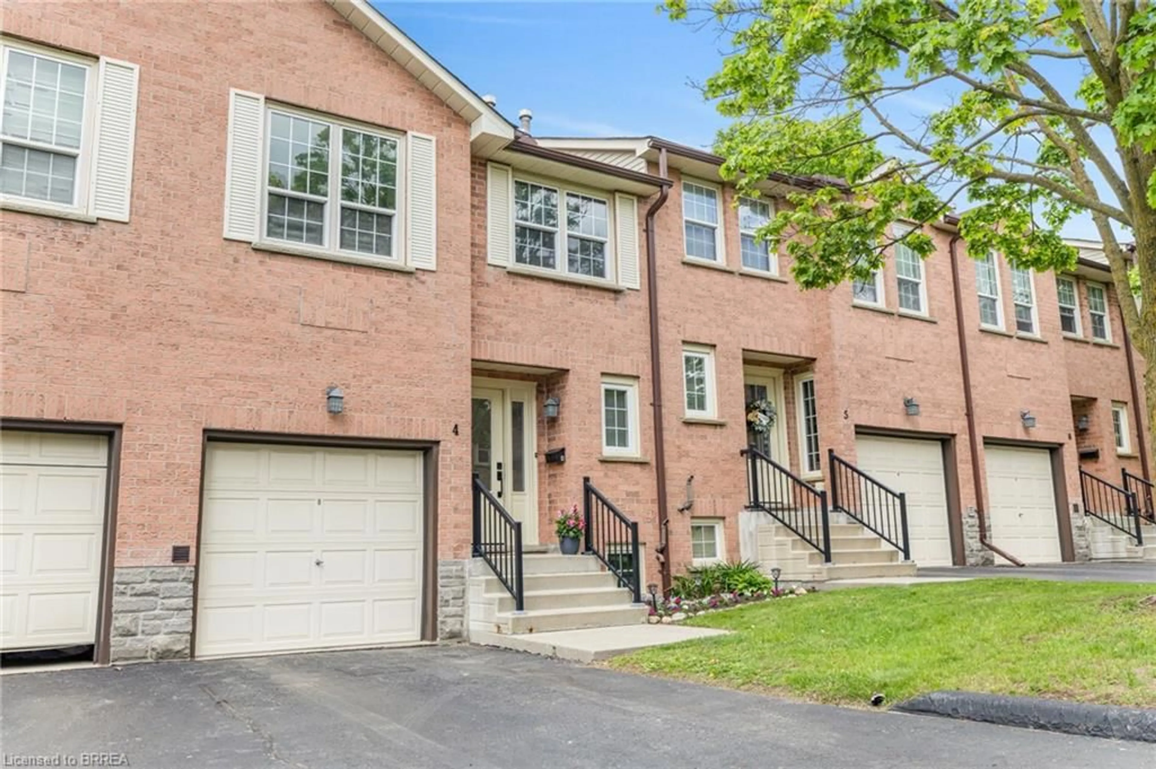 Home with brick exterior material, street for 375 Holiday Inn Dr #4, Cambridge Ontario N3C 3P6