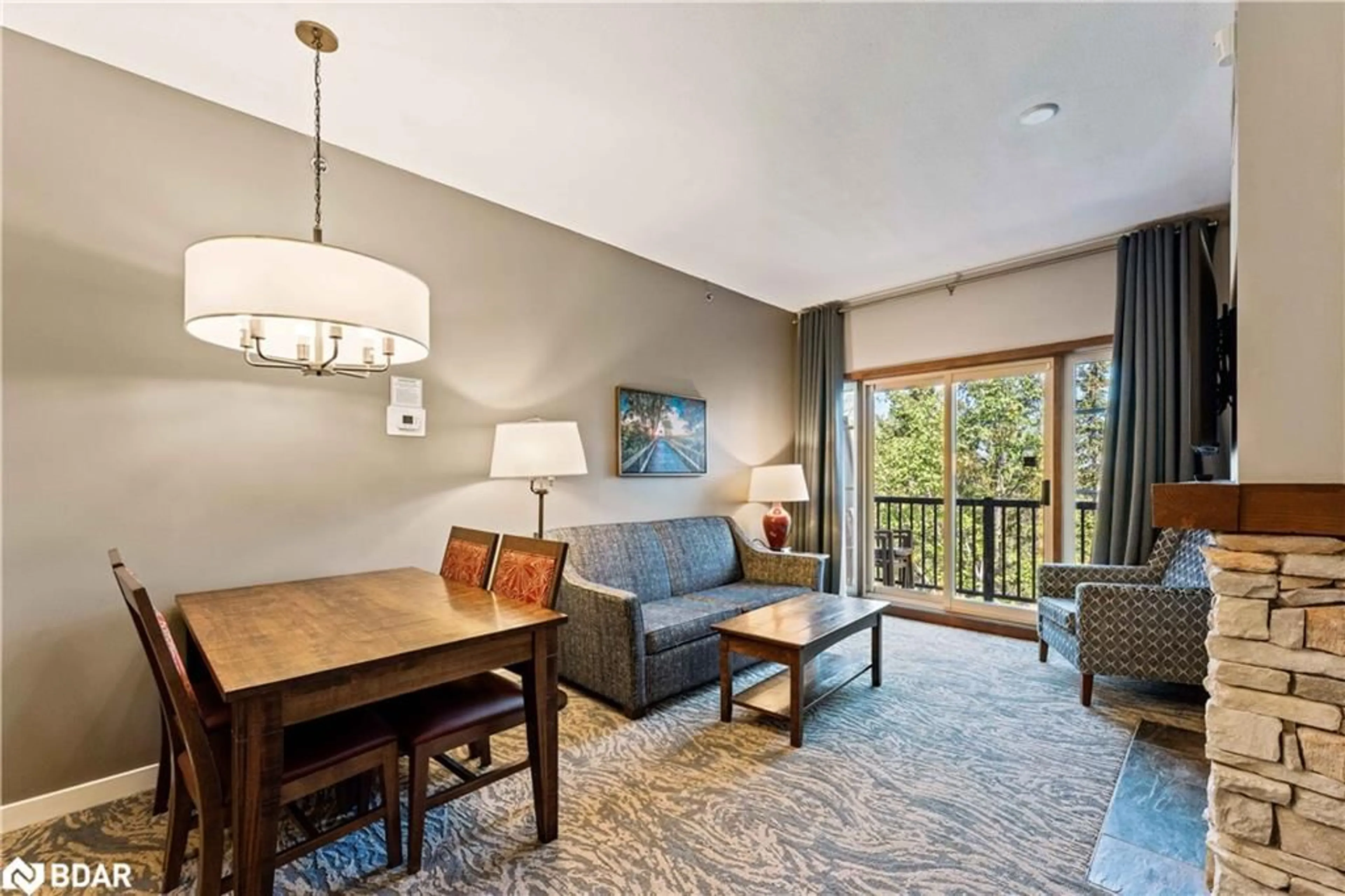 Living room with furniture, wood/laminate floor for 156 Jozo Weider Blvd #437, The Blue Mountains Ontario L9Y 0V2