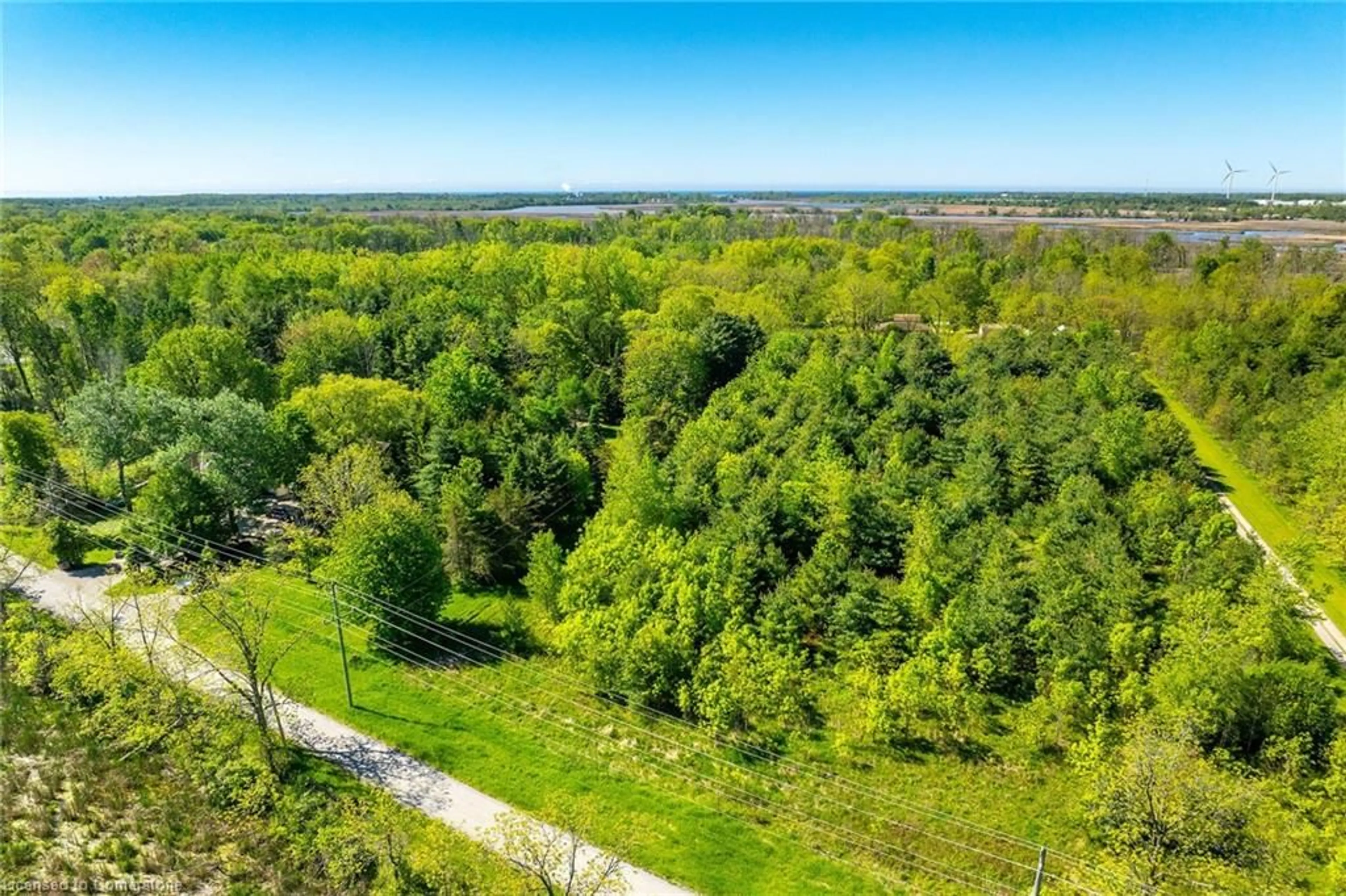 A pic from outside/outdoor area/front of a property/back of a property/a pic from drone, forest/trees view for 1172 North Shore Dr, Dunnville Ontario N1A 2W5