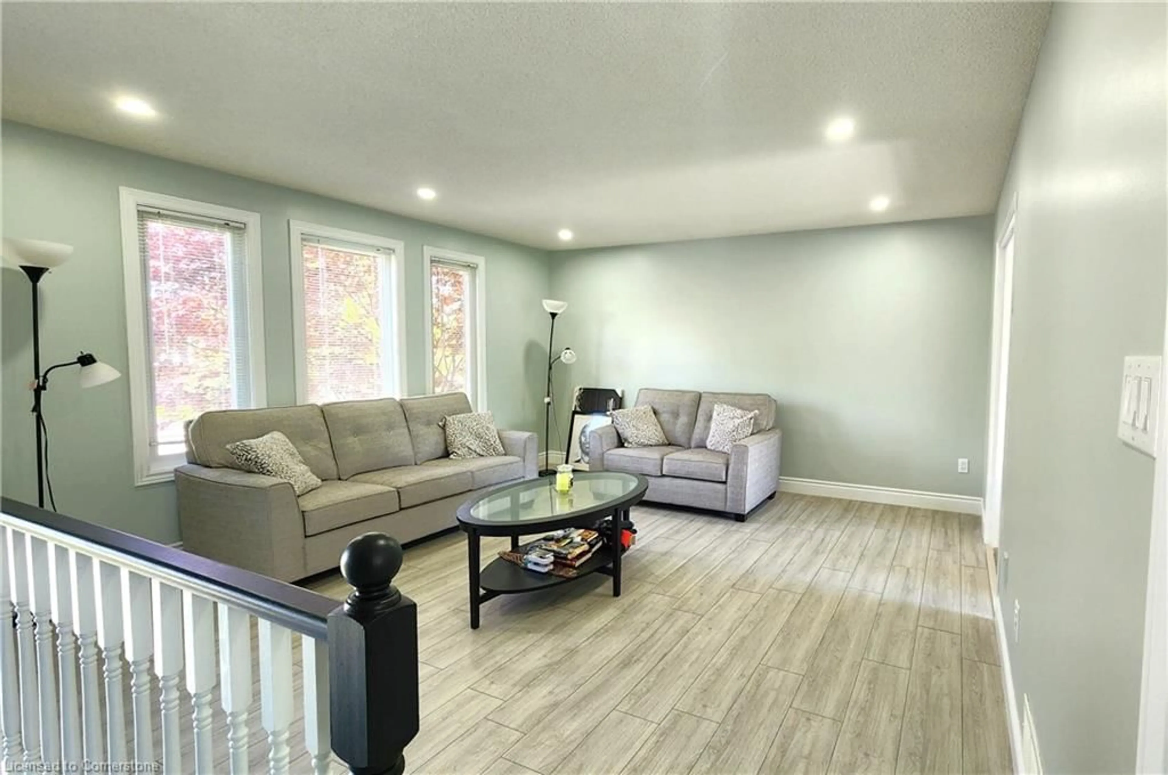 Living room with furniture, wood/laminate floor for 11 Maplecrest Lane, Brantford Ontario N3R 7V1
