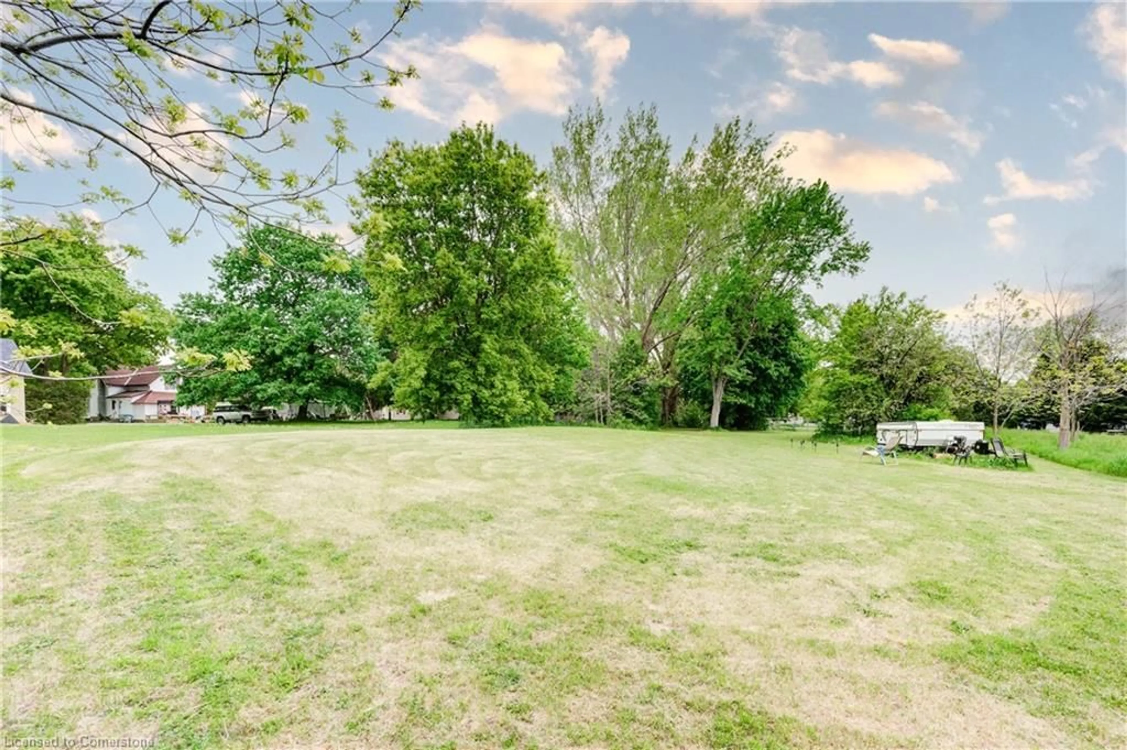 A pic from outside/outdoor area/front of a property/back of a property/a pic from drone, forest/trees view for 25 North St, Egmondville Ontario N0K 1G0