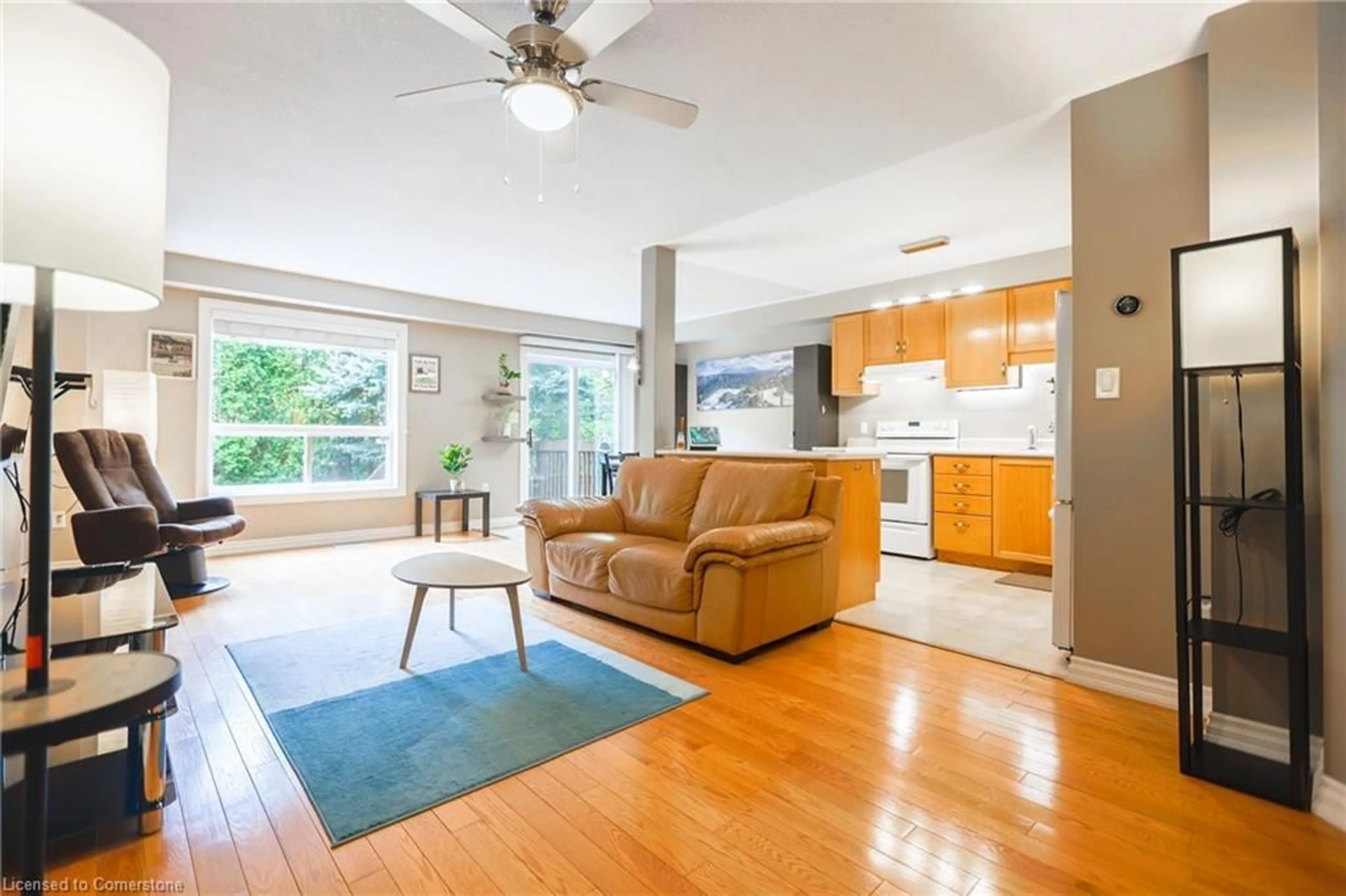 Living room with furniture, wood/laminate floor for 346 Highland Rd #50, Hamilton Ontario L8J 3T3