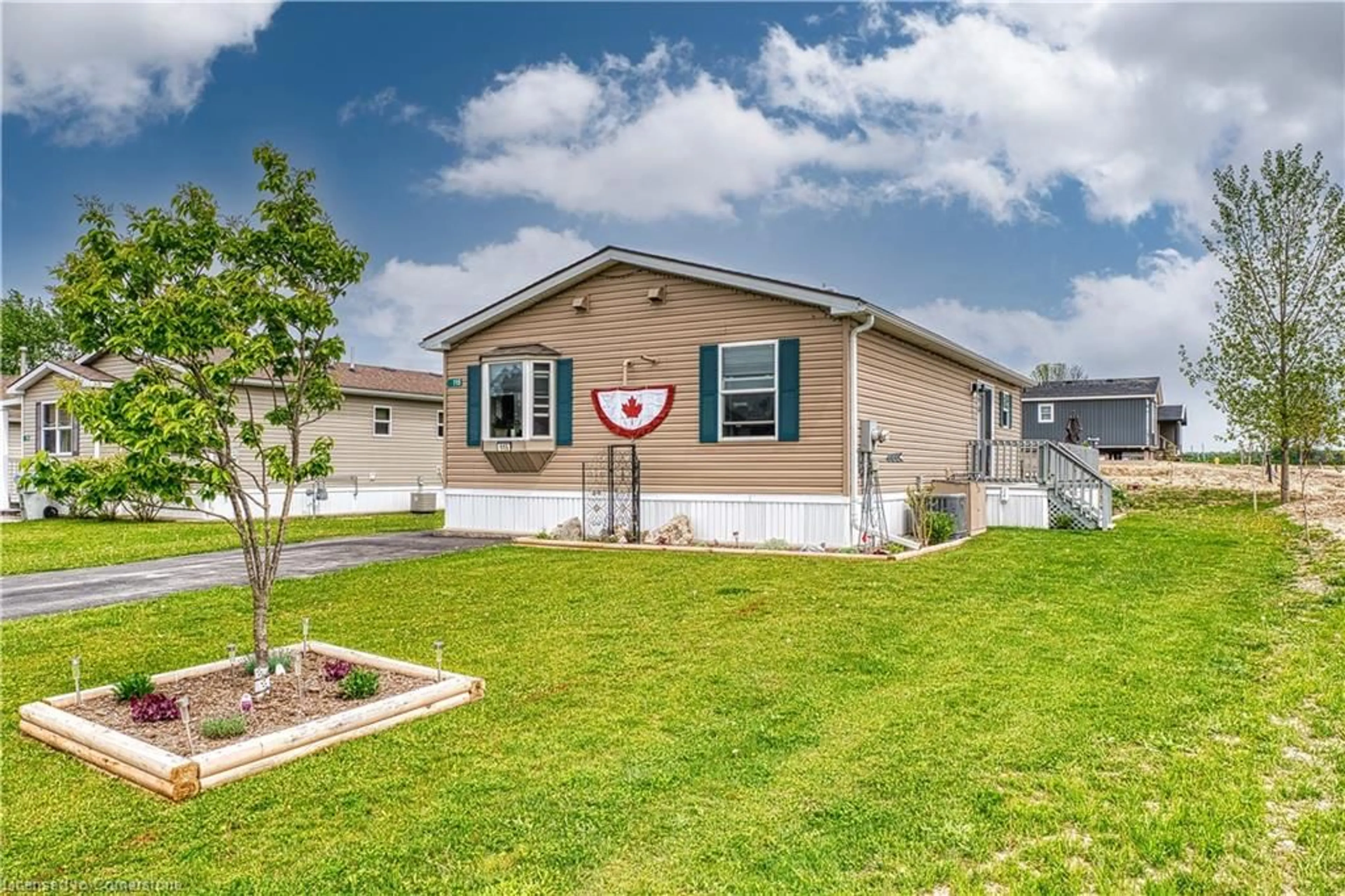 Home with vinyl exterior material, street for 115 Meadowview Lane, North Perth Ontario N4W 3G8