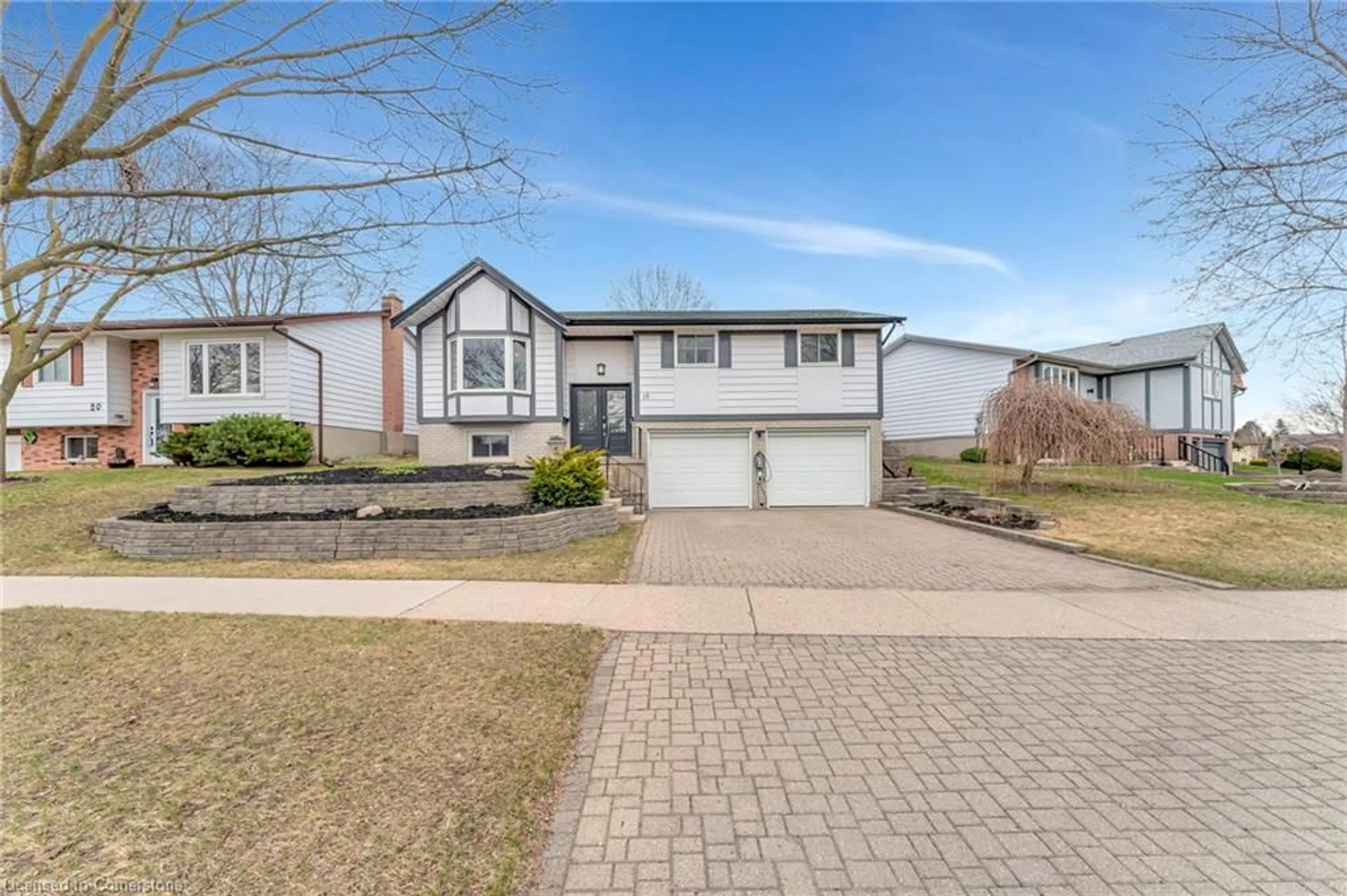 Home with vinyl exterior material, street for 16 Settlers Dr, Kitchener Ontario N2E 2L3