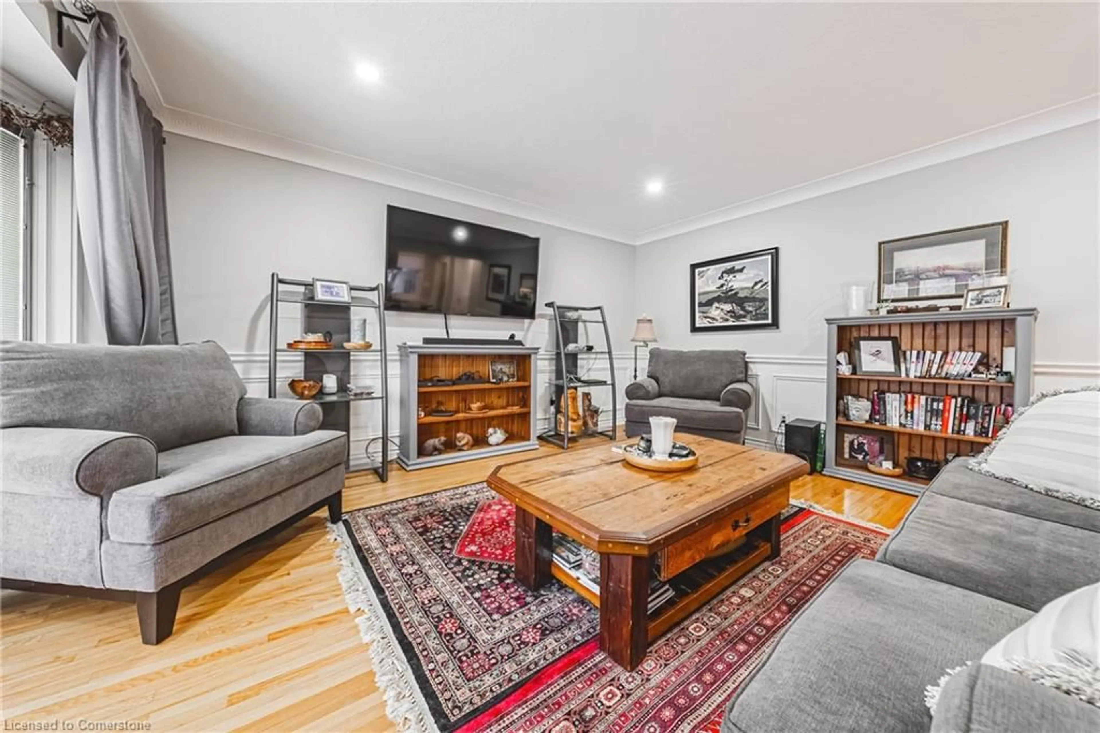 Living room with furniture, wood/laminate floor for 43 Holden Ave, Simcoe Ontario N3Y 4E4