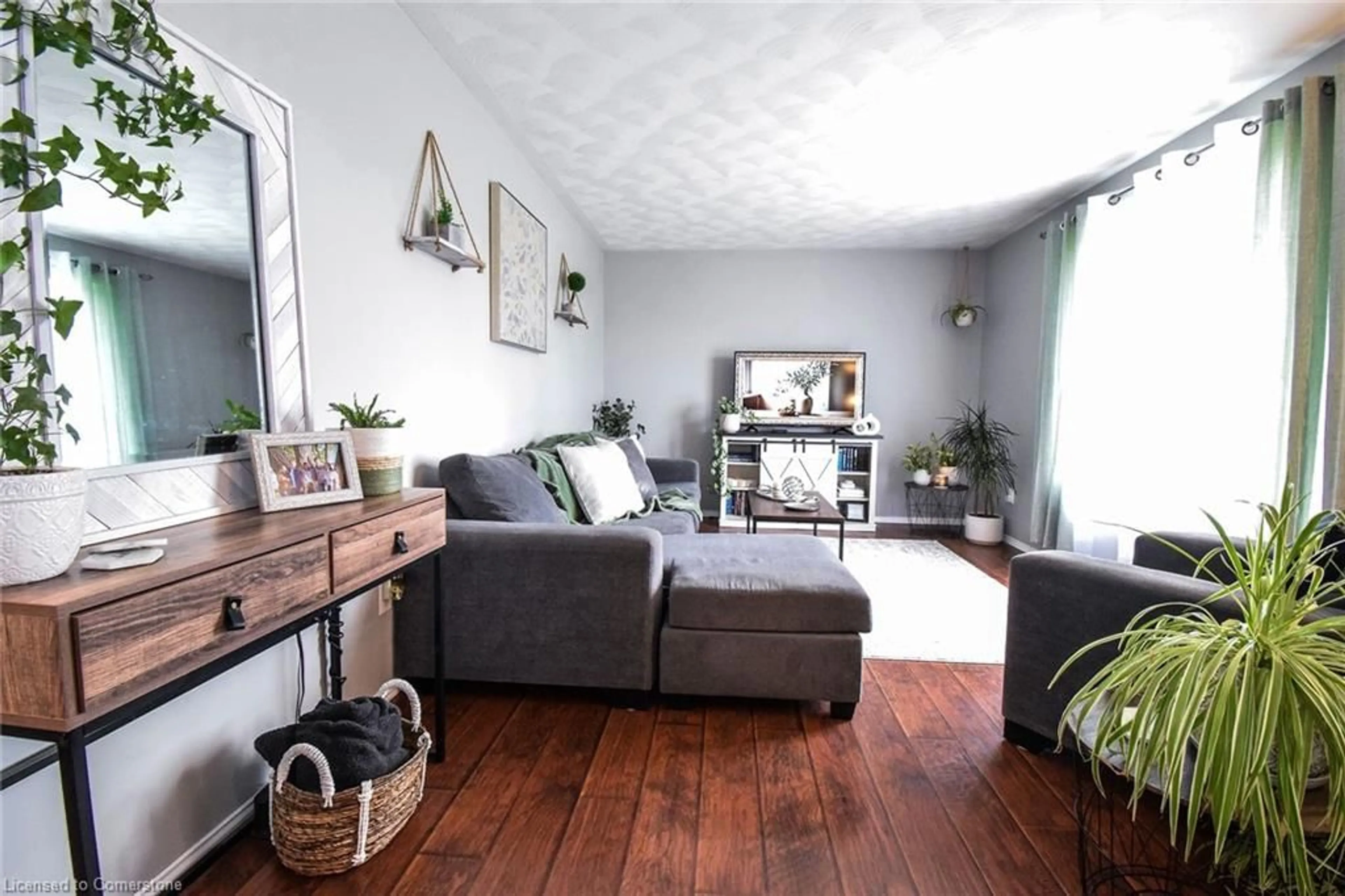 Living room with furniture, wood/laminate floor for 204 Bolton Tract Rd, Dunnville Ontario N1A 2A3