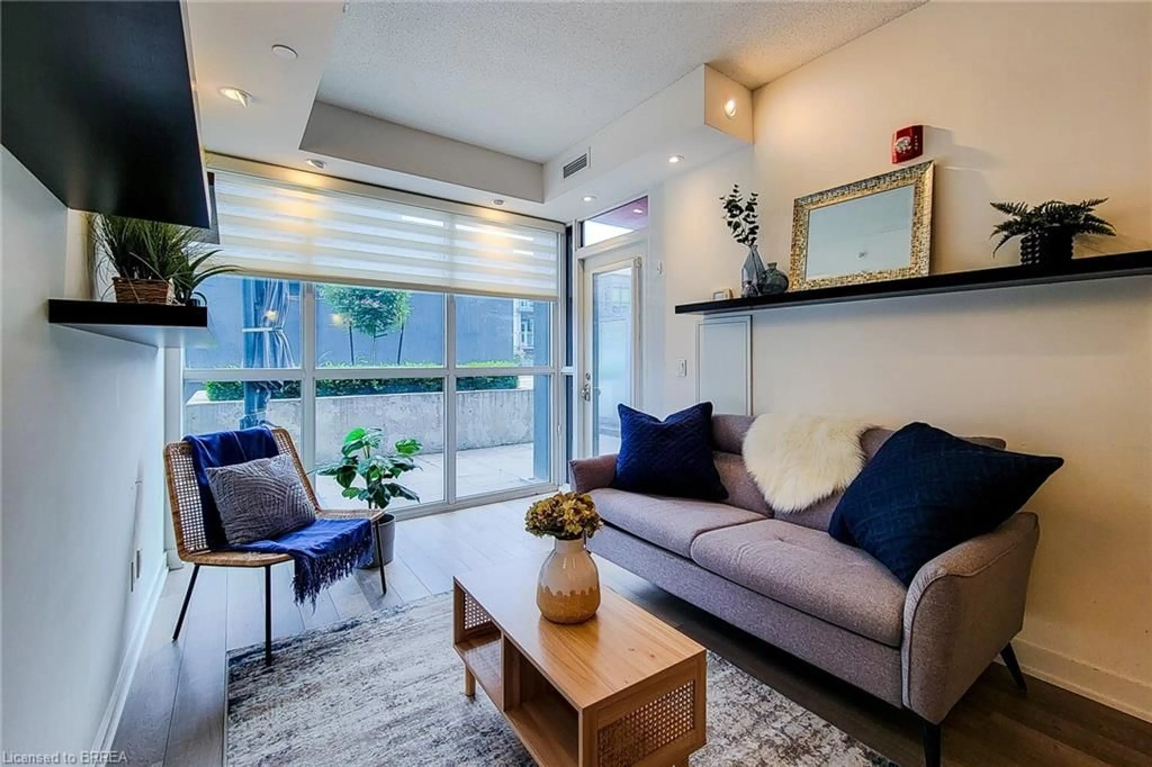 Living room with furniture, unknown for 5240 Dundas St #B215, Burlington Ontario L7L 0J6