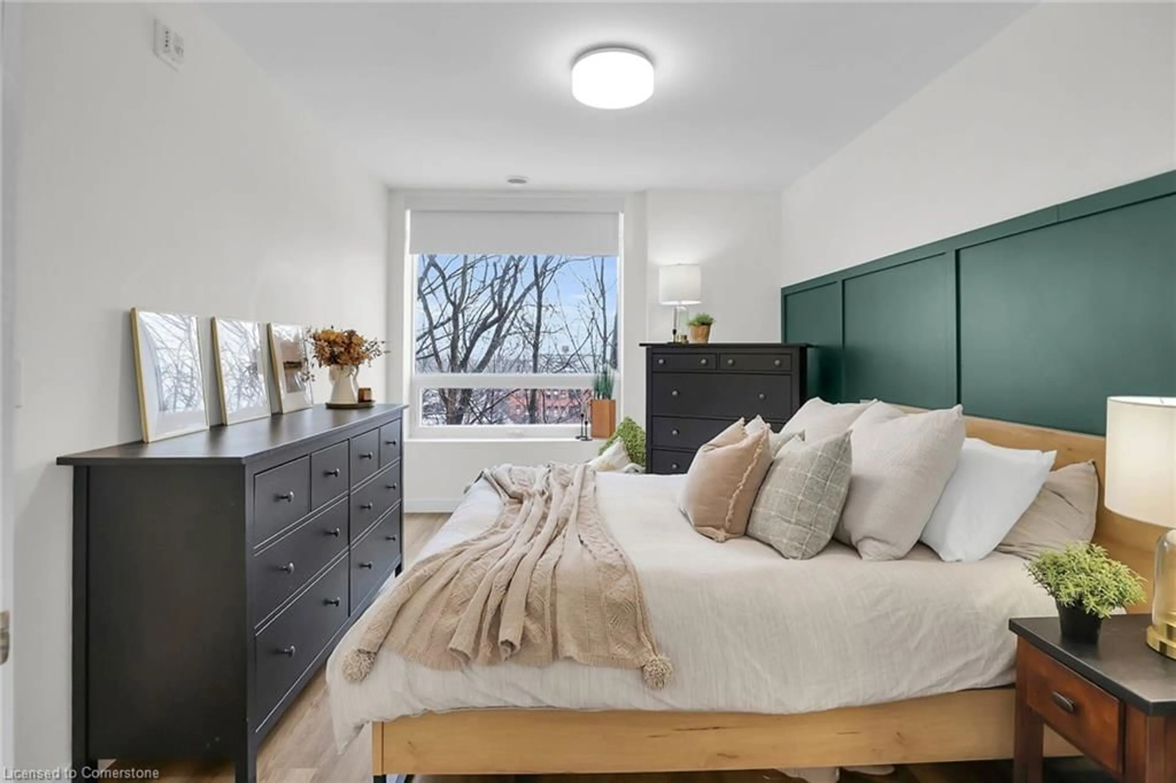 Bedroom with bed, wood/laminate floor for 479 Charlton Avenue East Ave #106, Hamilton Ontario L8N 0B4