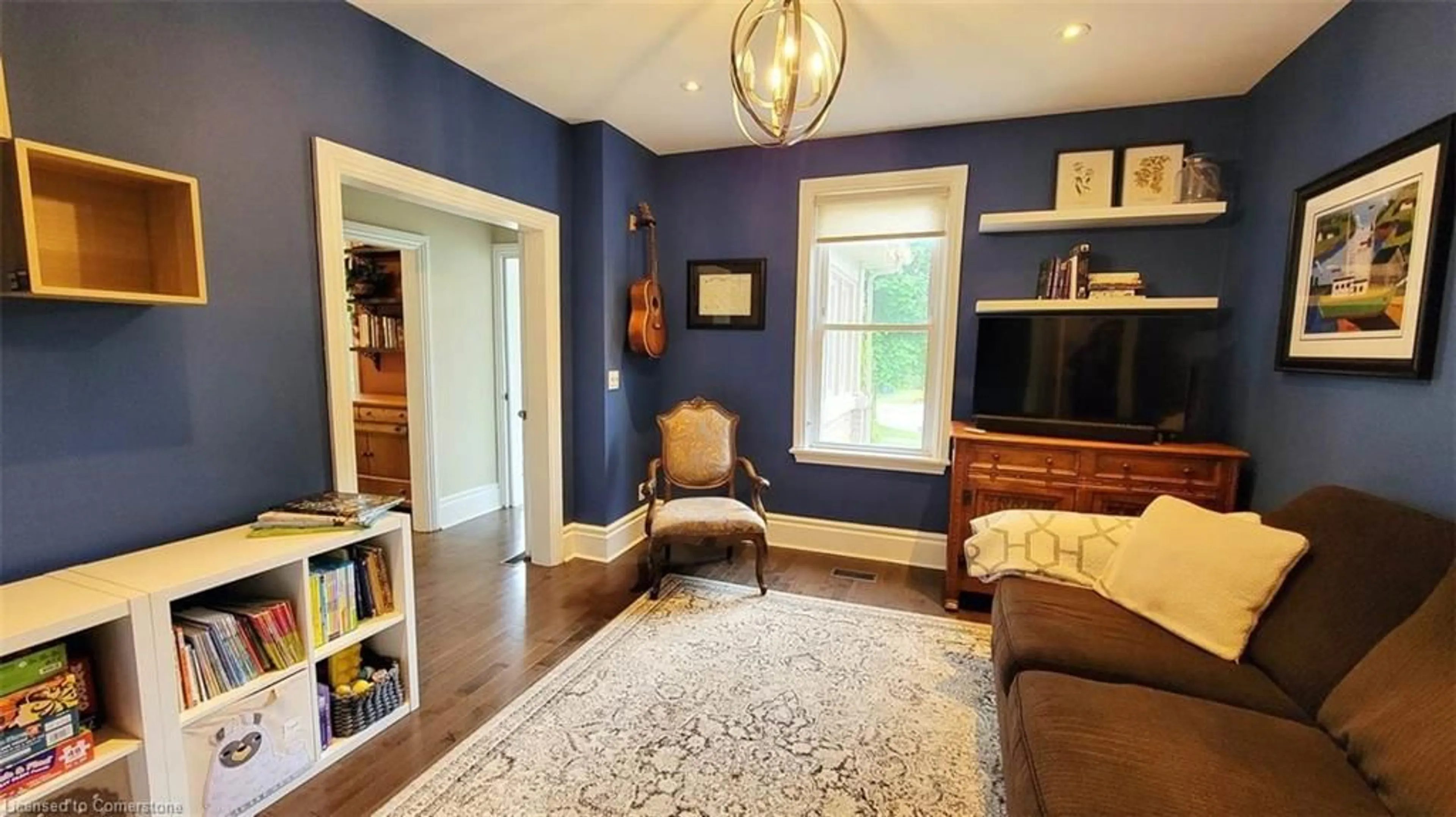 Living room with furniture, wood/laminate floor for 287 Waterloo Ave, Guelph Ontario N1H 3J7