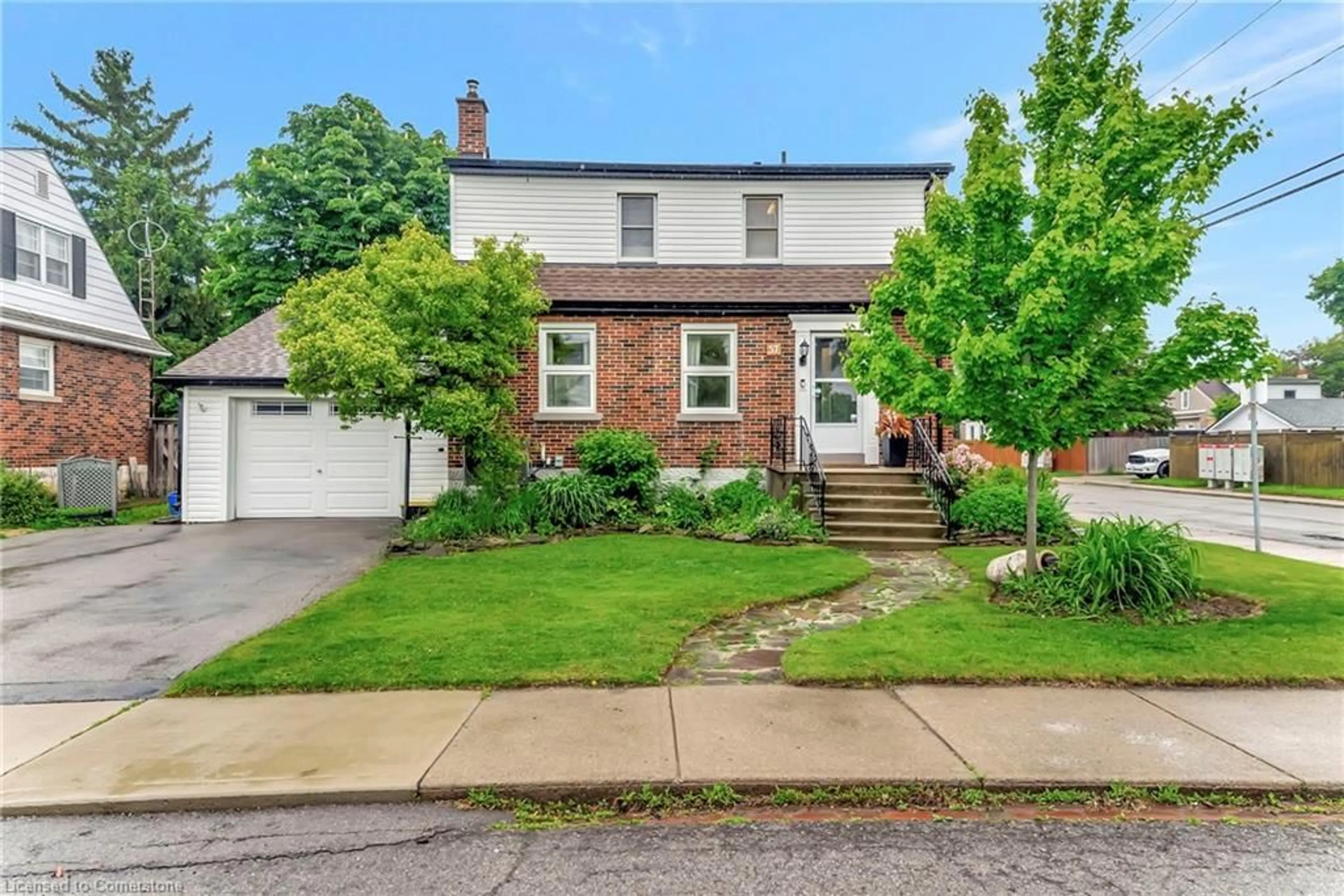 Home with brick exterior material, street for 57 West 4th St, Hamilton Ontario L9C 3M5