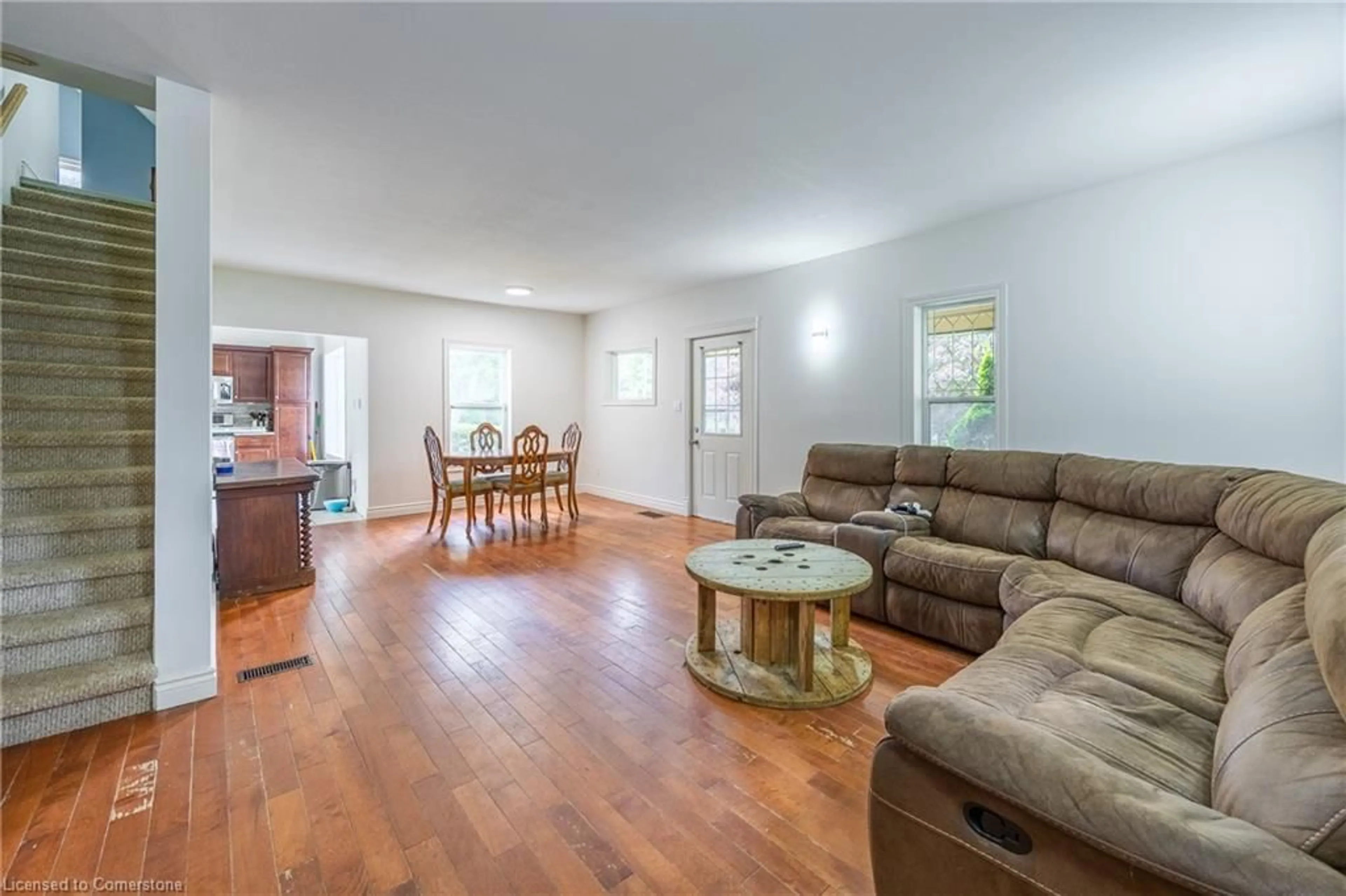 Living room with furniture, wood/laminate floor for 263 Main St, Otterville Ontario N0J 1R0