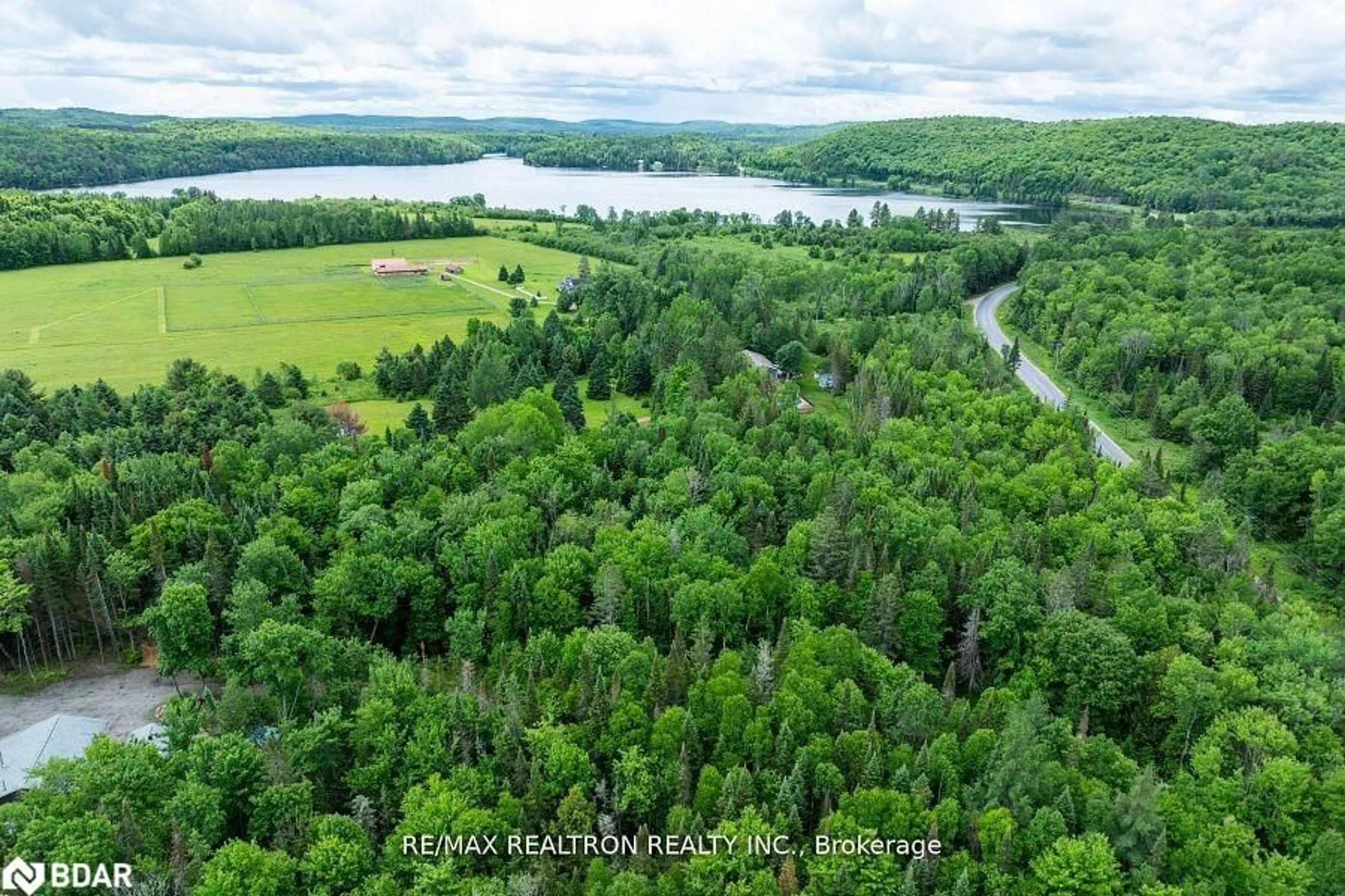 A pic from outside/outdoor area/front of a property/back of a property/a pic from drone, water/lake/river/ocean view for 2661 Highway 518, Kearney Ontario P0A 1M0