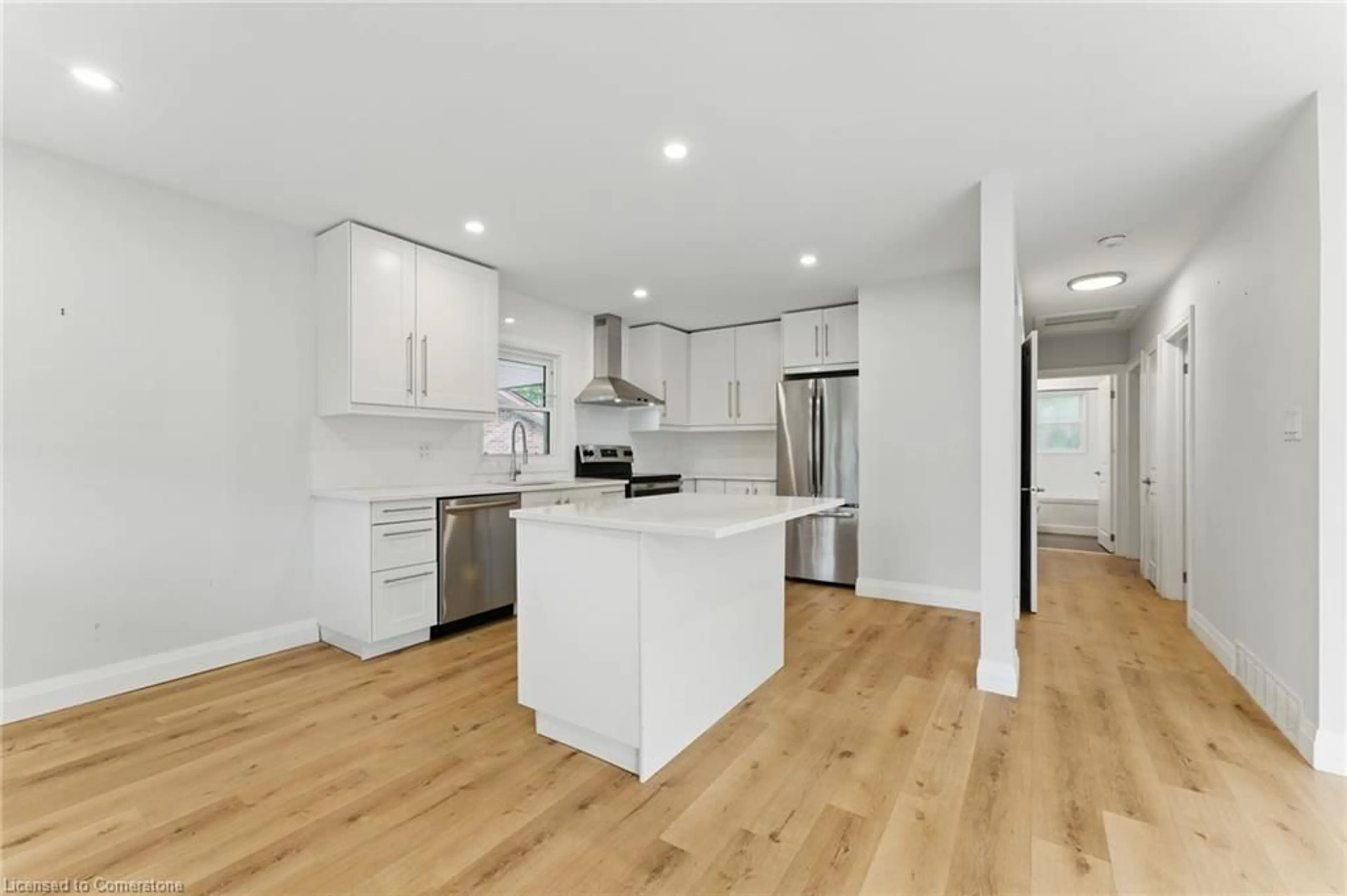 Open concept kitchen, wood/laminate floor for 204 Clark Ave, Kitchener Ontario N2C 1Y5