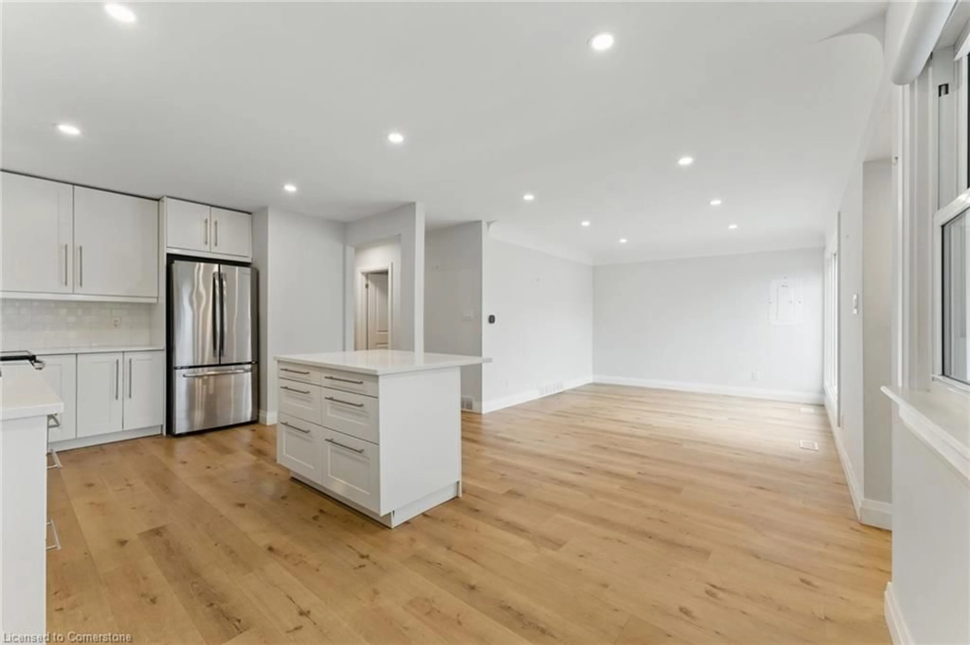 Open concept kitchen, wood/laminate floor for 204 Clark Ave, Kitchener Ontario N2C 1Y5