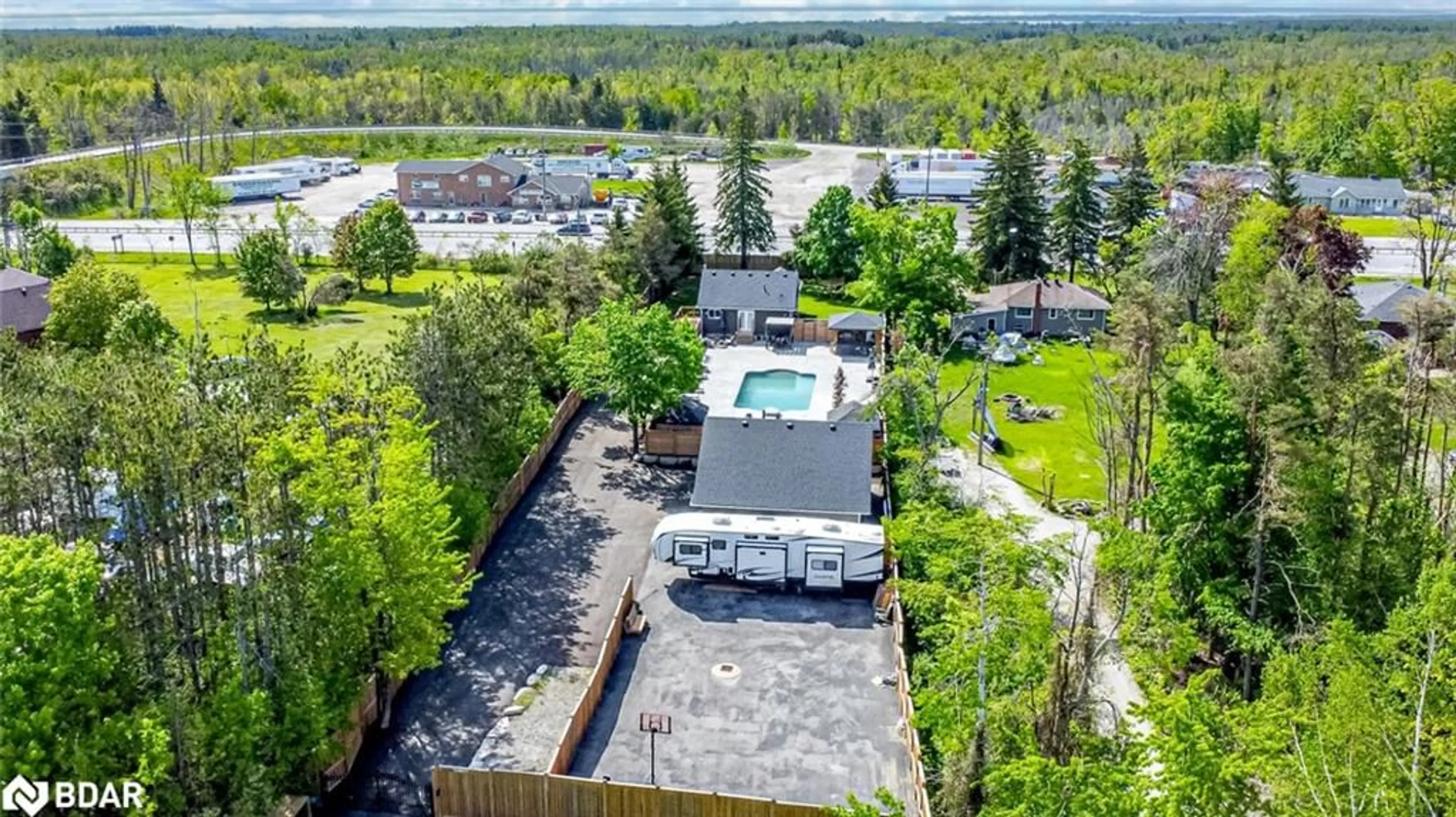 A pic from outside/outdoor area/front of a property/back of a property/a pic from drone, unknown for 2484 Highway 11, Oro-Medonte Ontario L0L 2E0