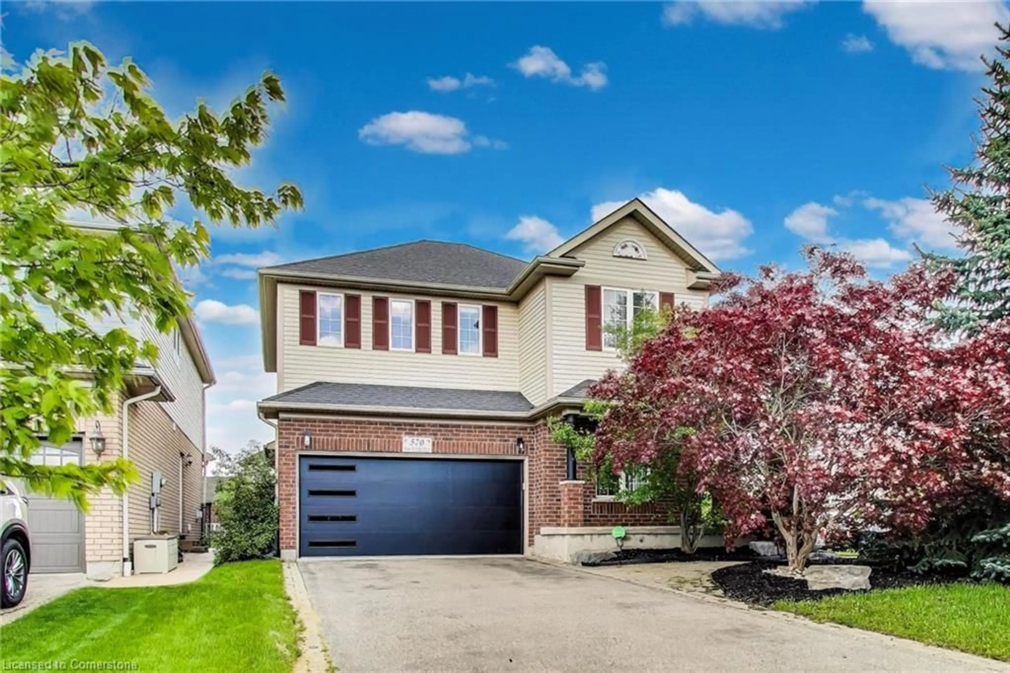 Home with brick exterior material, street for 570 New Bedford Dr, Waterloo Ontario N2K 4M7