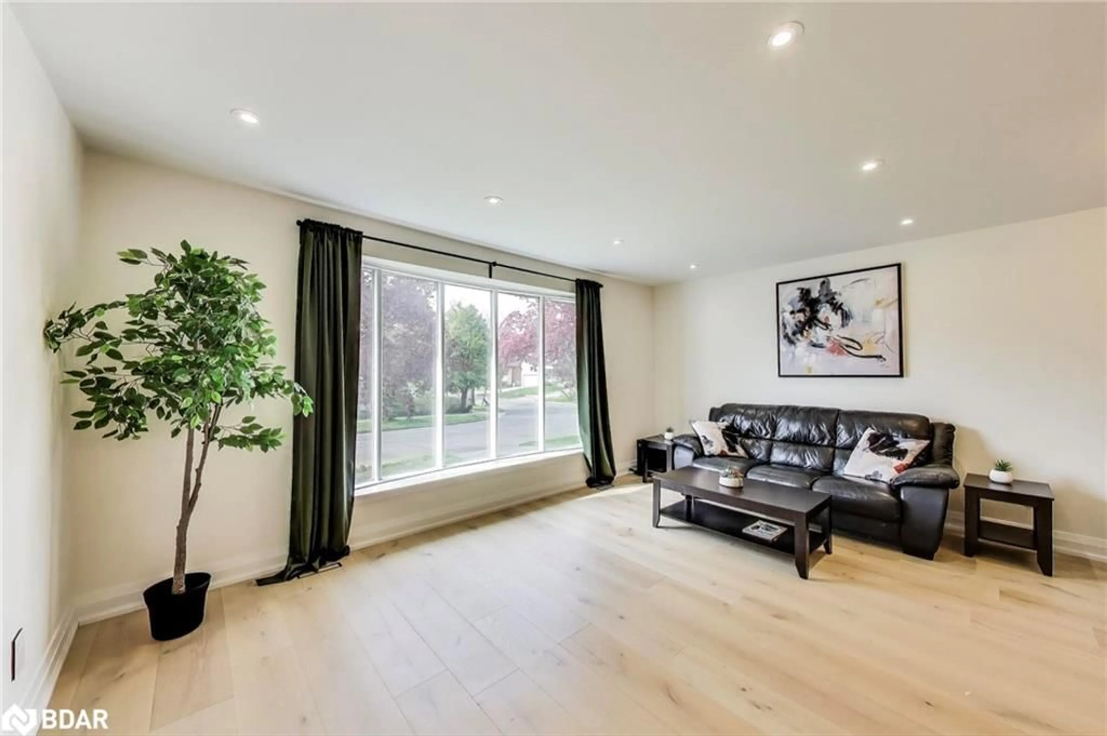 Living room with furniture, wood/laminate floor for 28 Munford Cres, East York Ontario M4B 1C1