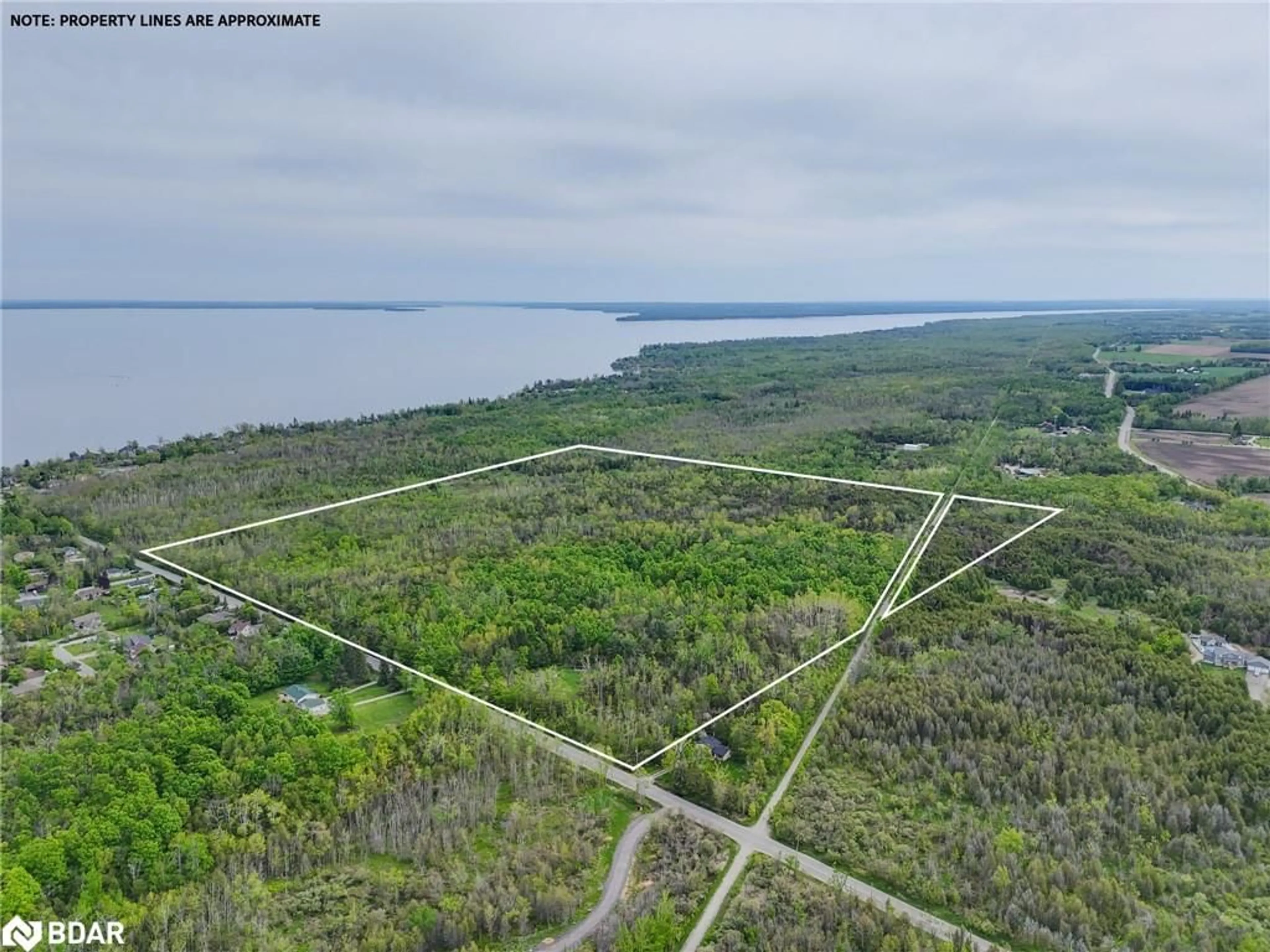 A pic from outside/outdoor area/front of a property/back of a property/a pic from drone, water/lake/river/ocean view for 552 10 Line, Oro-Medonte Ontario L0L 1T0