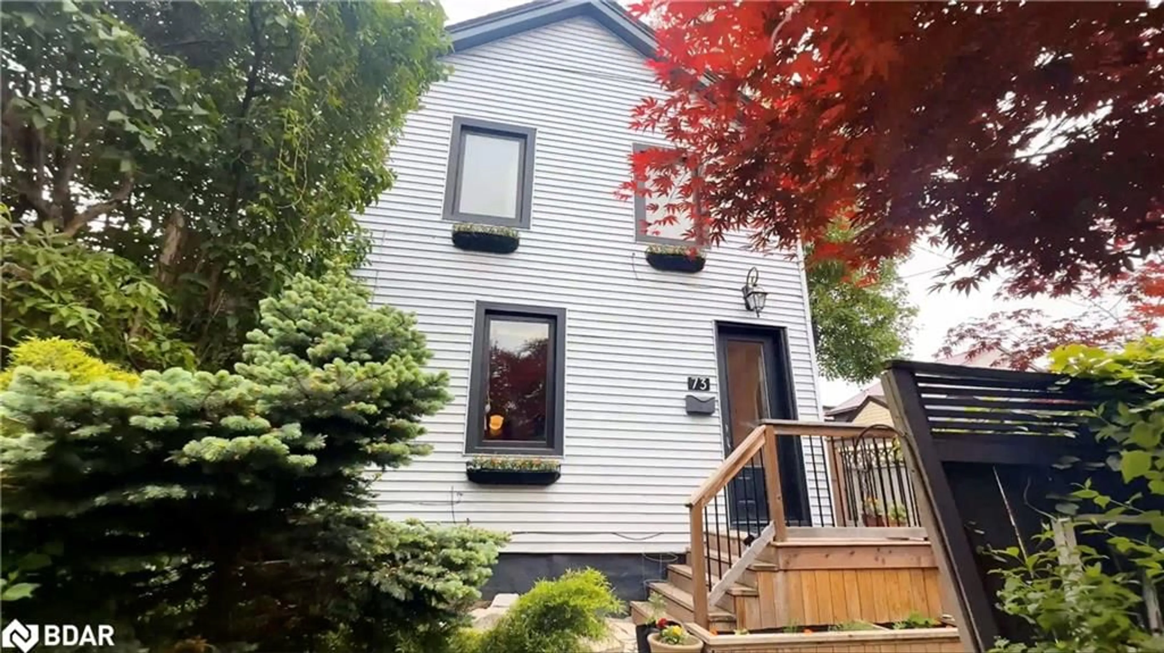 Home with vinyl exterior material, street for 73 Pearl St, Hamilton Ontario L8R 2Z1