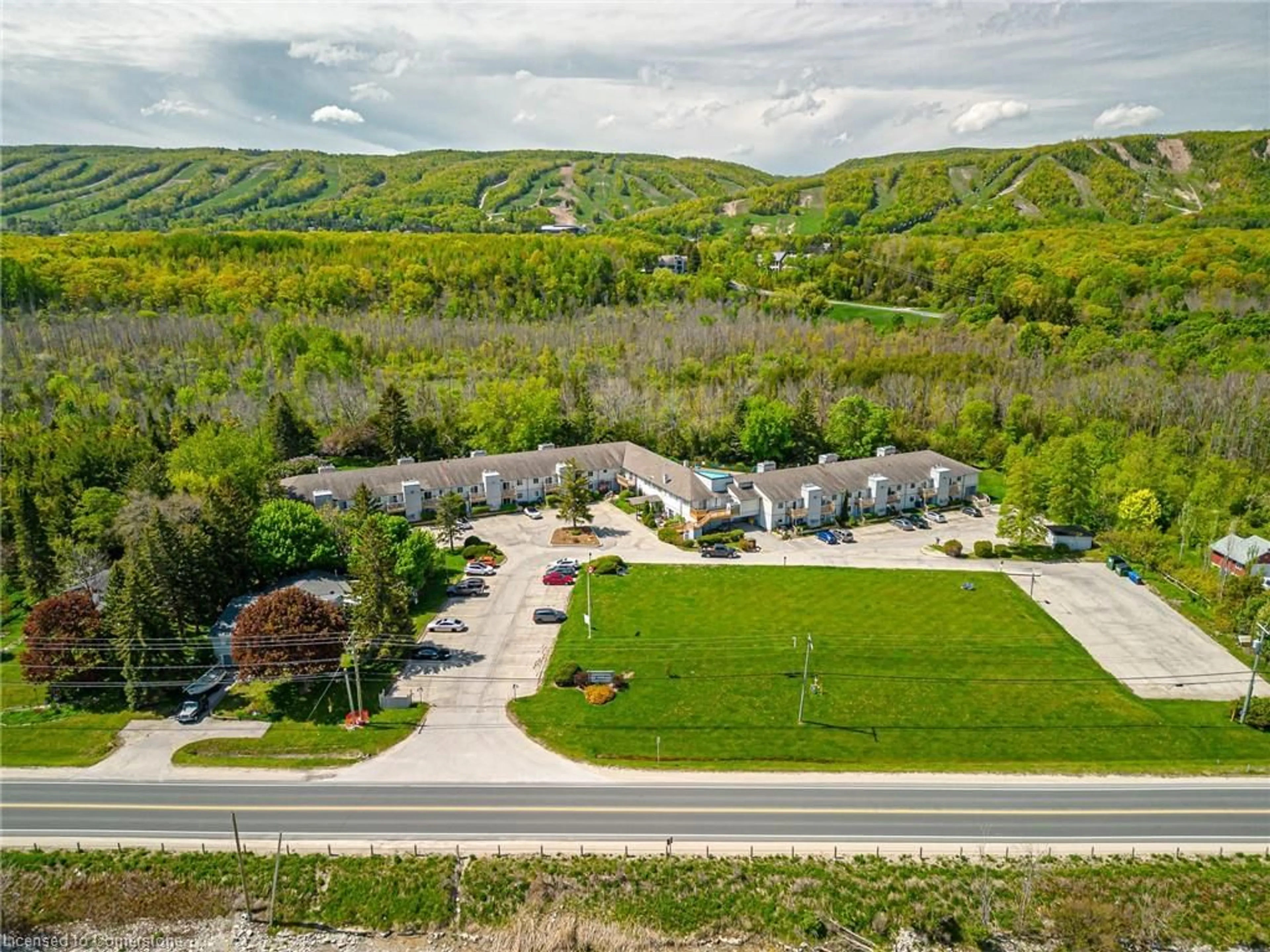 A pic from outside/outdoor area/front of a property/back of a property/a pic from drone, mountain view for 209472 26 Hwy #19, The Blue Mountains Ontario L9Y 0V3