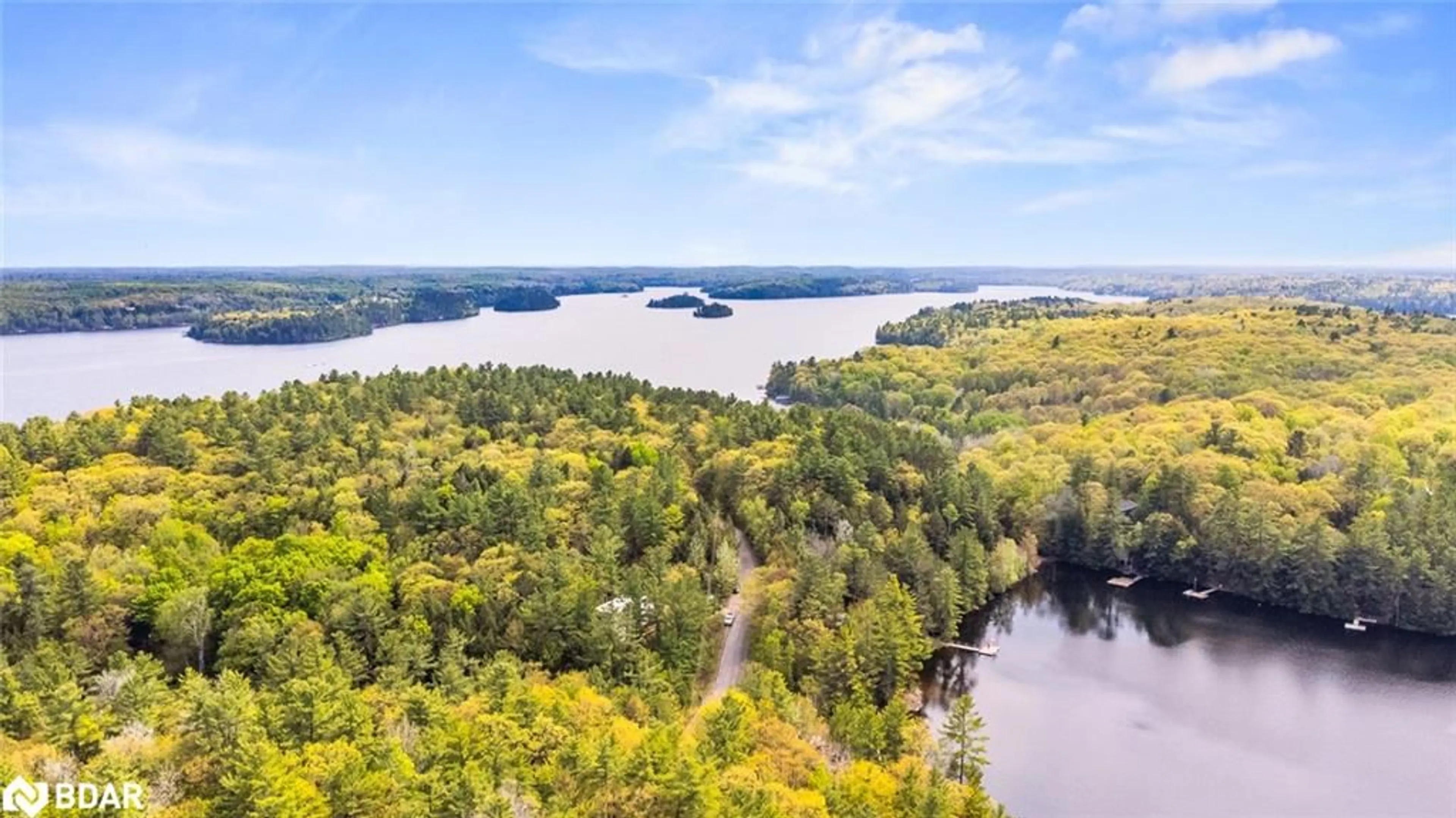 A pic from outside/outdoor area/front of a property/back of a property/a pic from drone, water/lake/river/ocean view for 1452 Rackety Trail Rd, Minden Ontario K0M 2K0